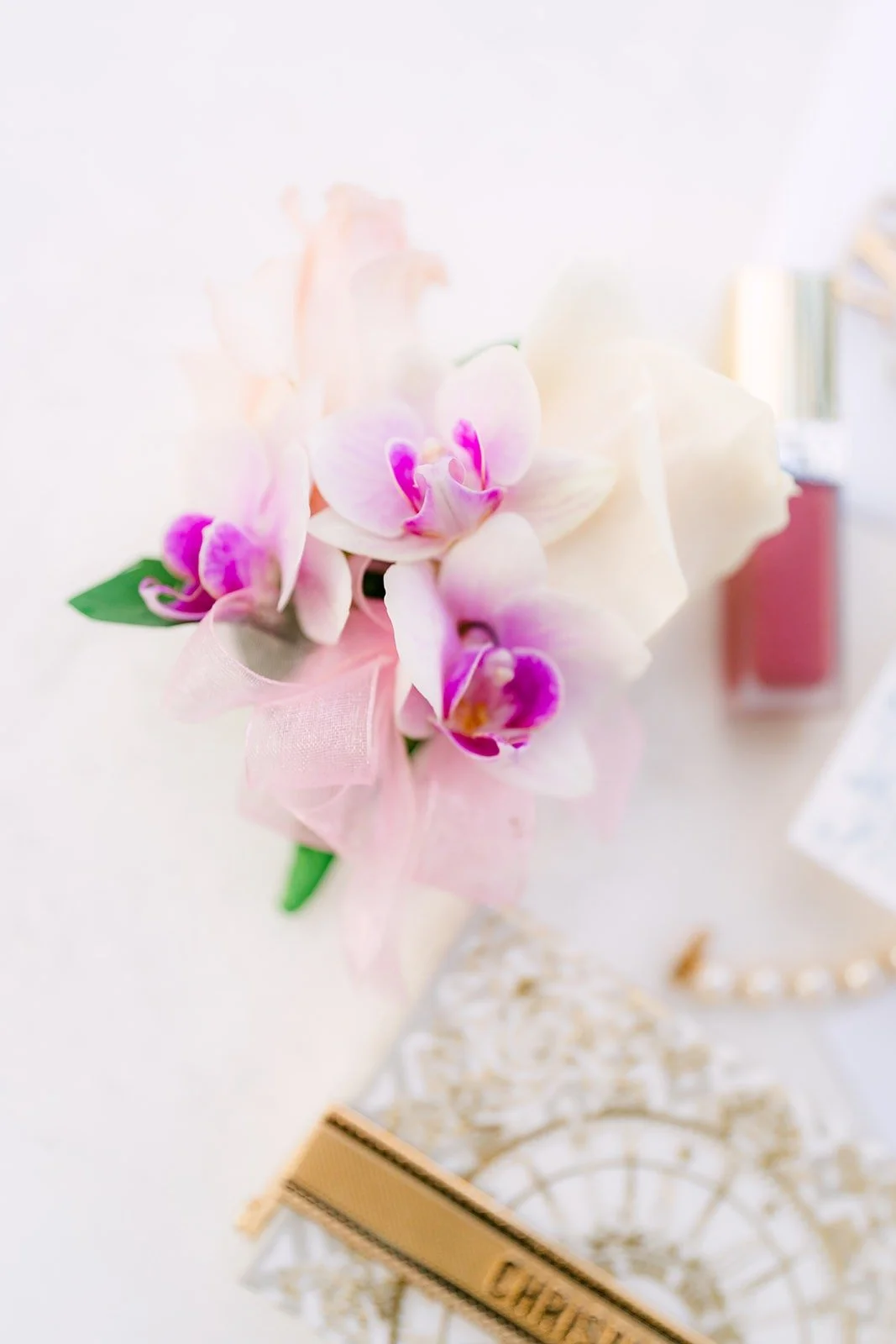 Pink orchids, a lace fan and Ivy's accessories