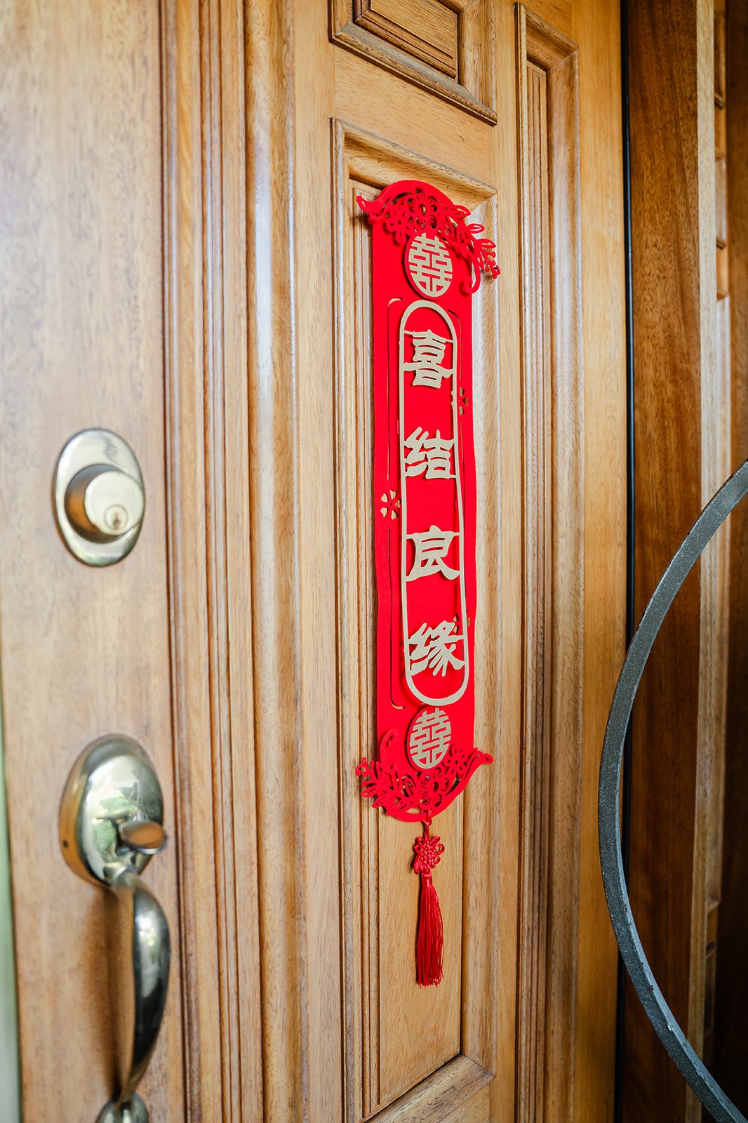 Red couplets on the wooden front door.