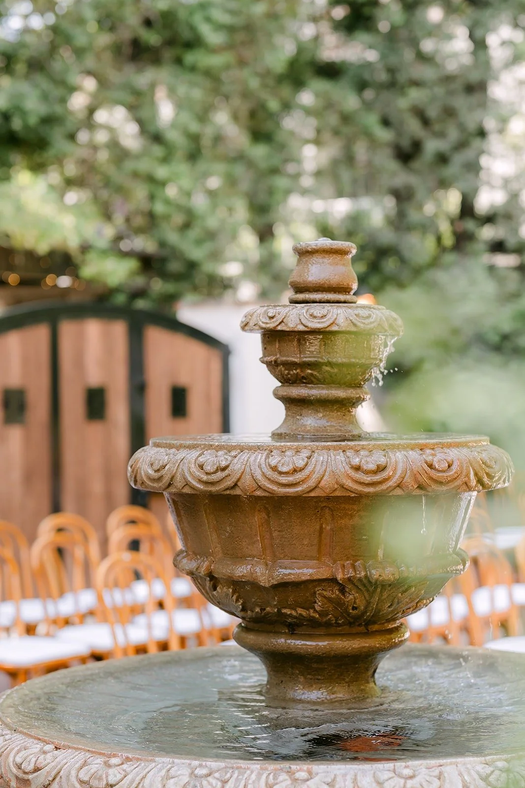 A stone fountain in the courtyard at Franciscan Gardens