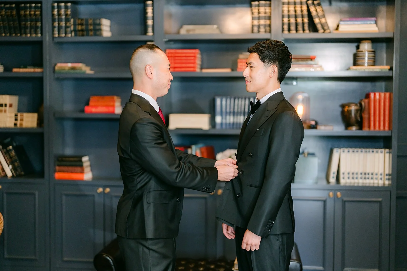 Richard greeting a groomsman in the library style suite at The Harper