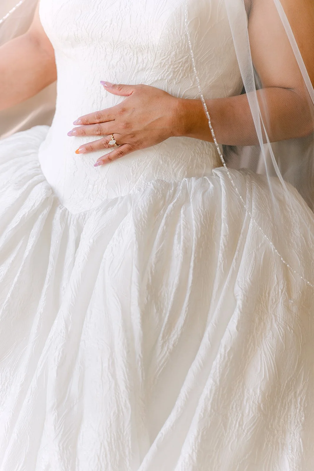 A close detail of Angela's sweetheart gown