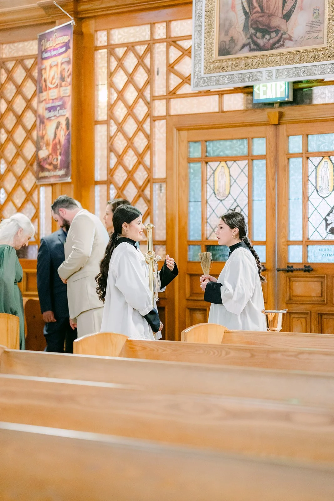 Guests arriving in the pews before the ceremony.