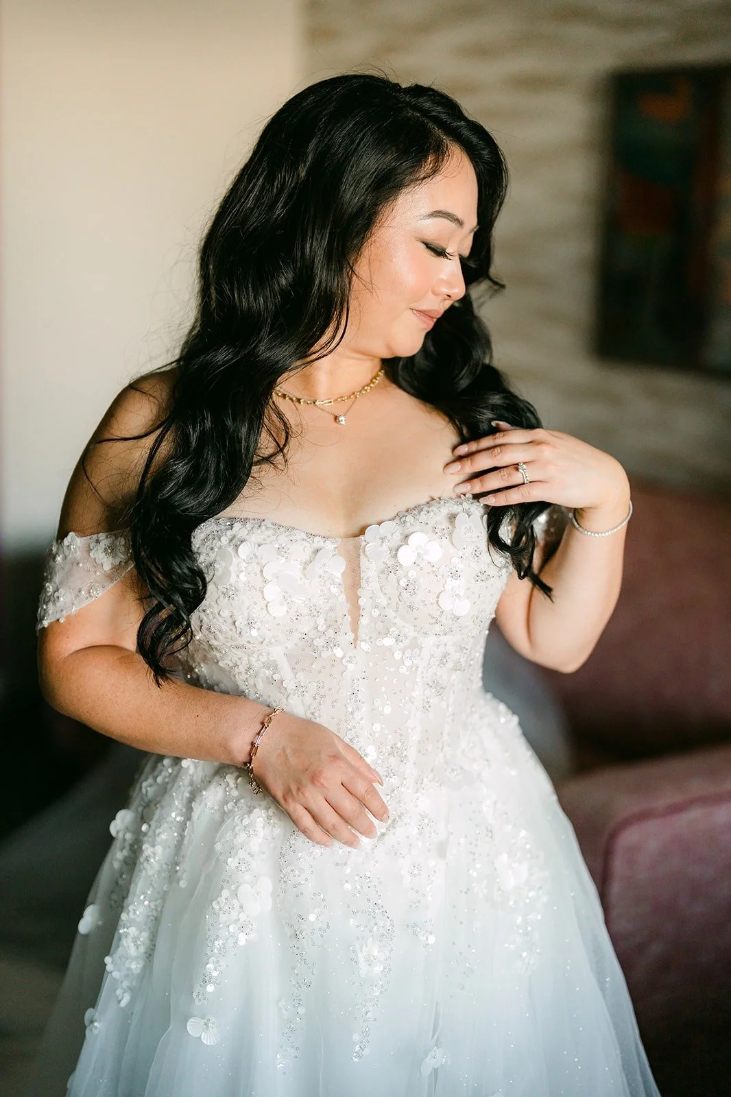 Jennifer in her off the shoulder lace gown by the window