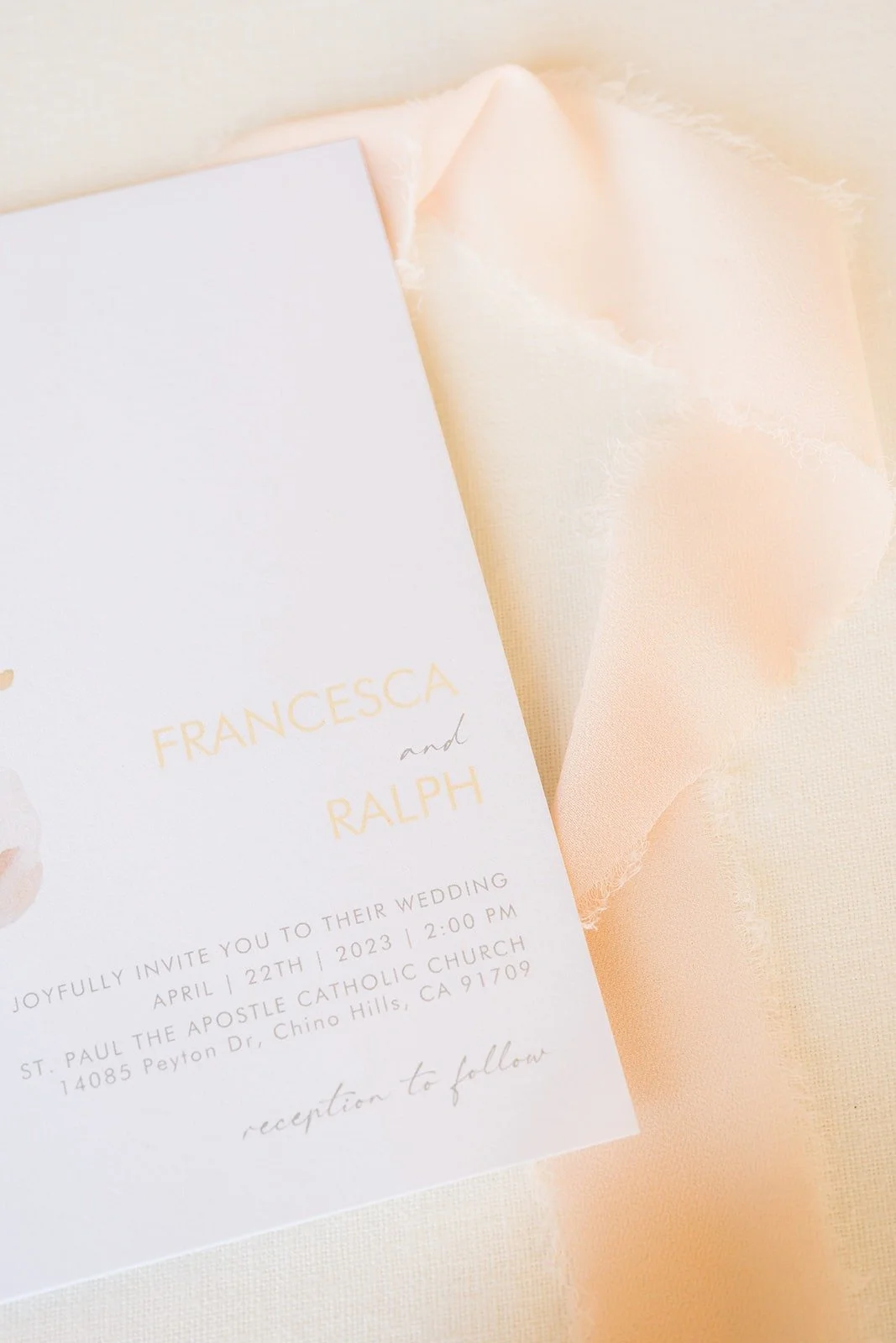 Invitation for Francesca and Ralph's wedding on a peach silk ribbon