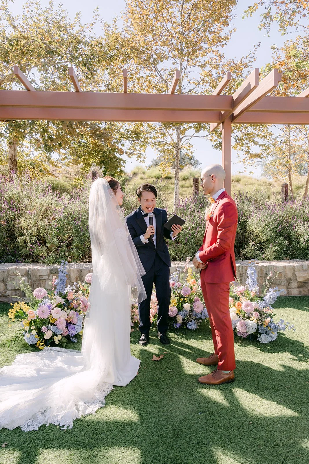 Christie and Christian facing each other under the pergola at Quail Hill Community Center.