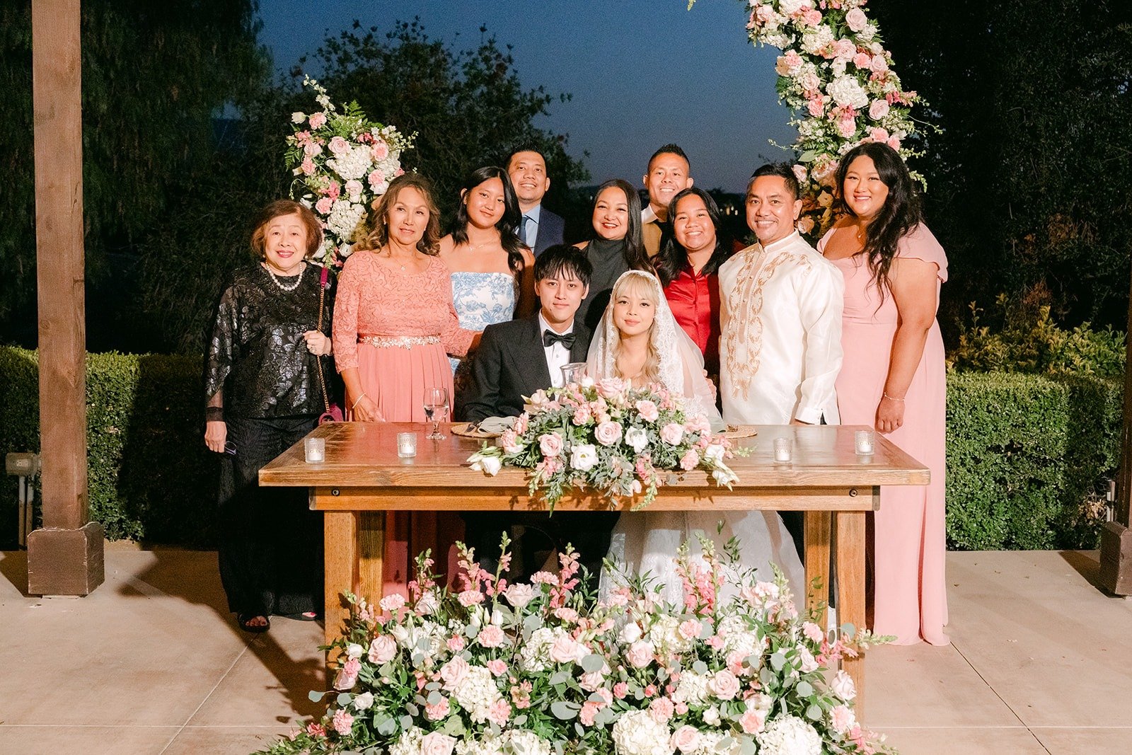 Guests gathered around the sweetheart table for photos