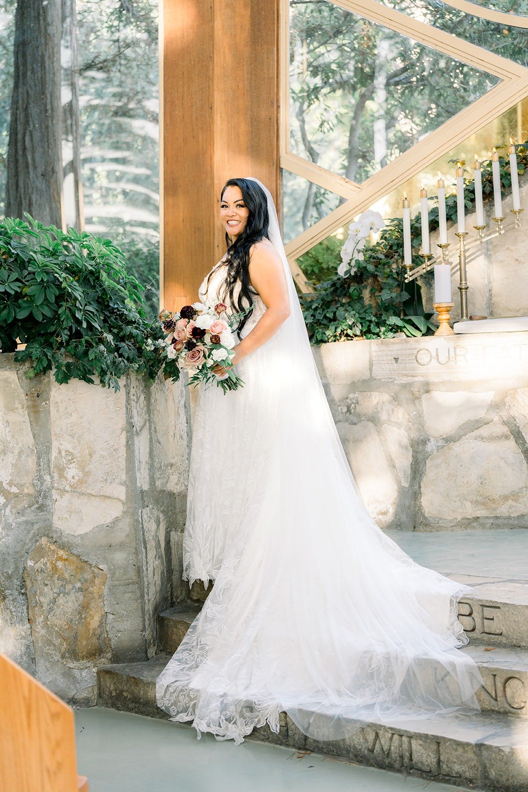 Betsy on the stone steps among the trees, photographed by One and Only Production