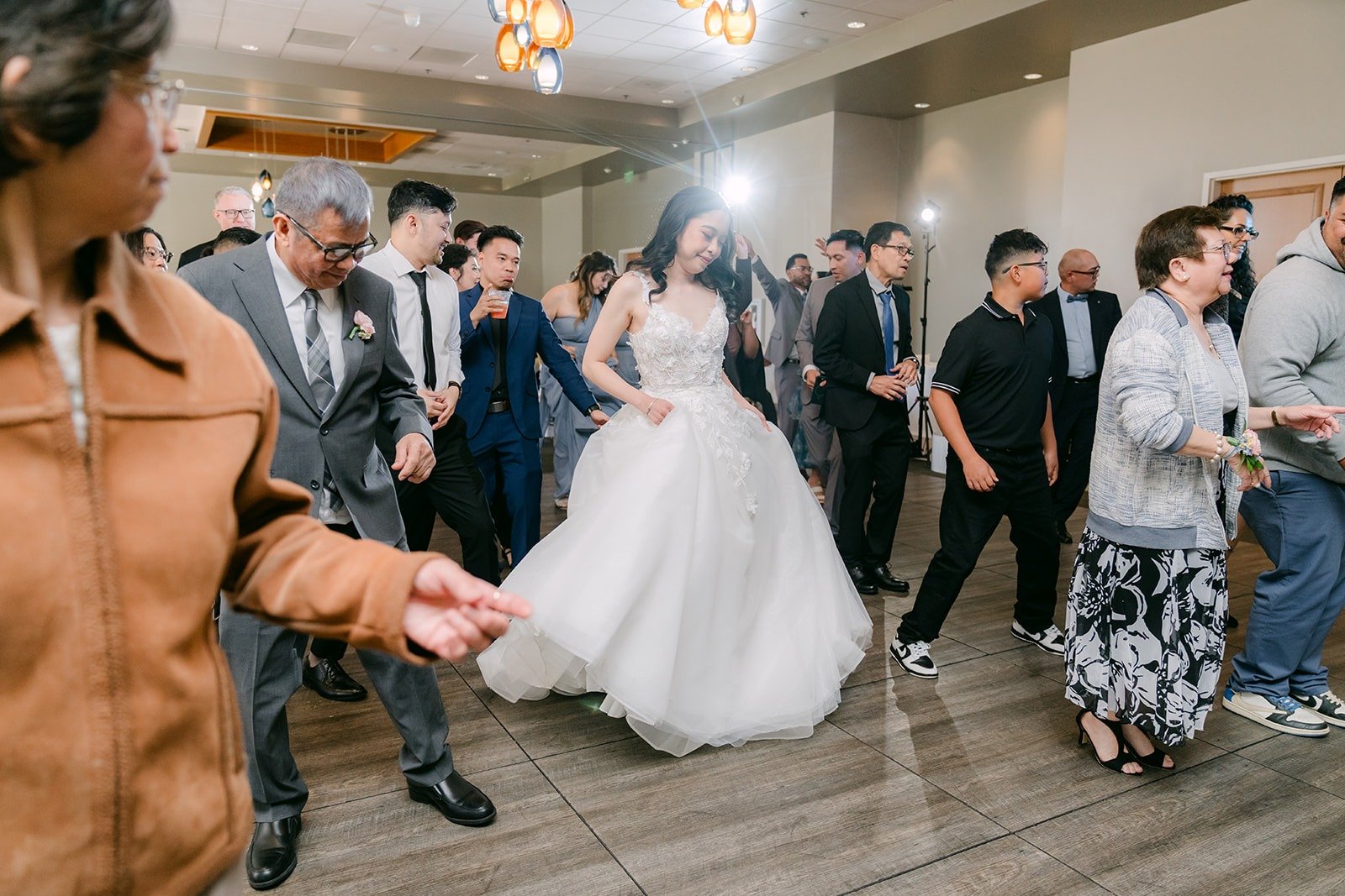 Natalie dancing with guests on a full dance floor