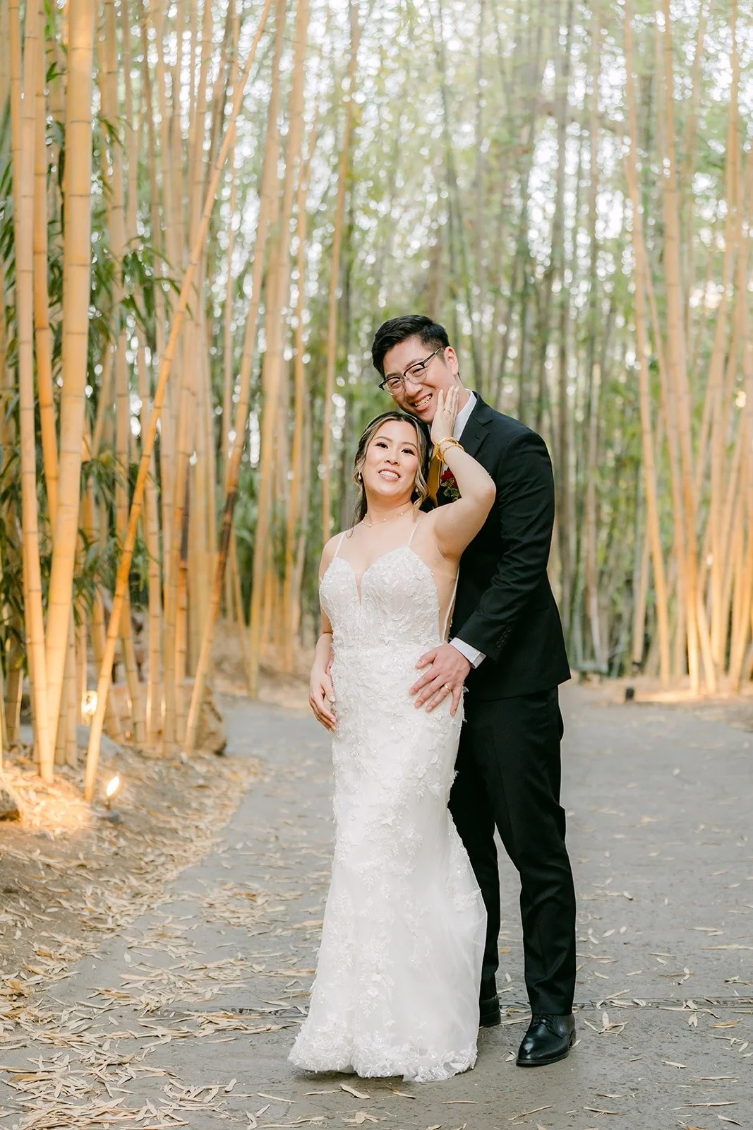 Zach holding Joanne from behind on the path through the bamboo