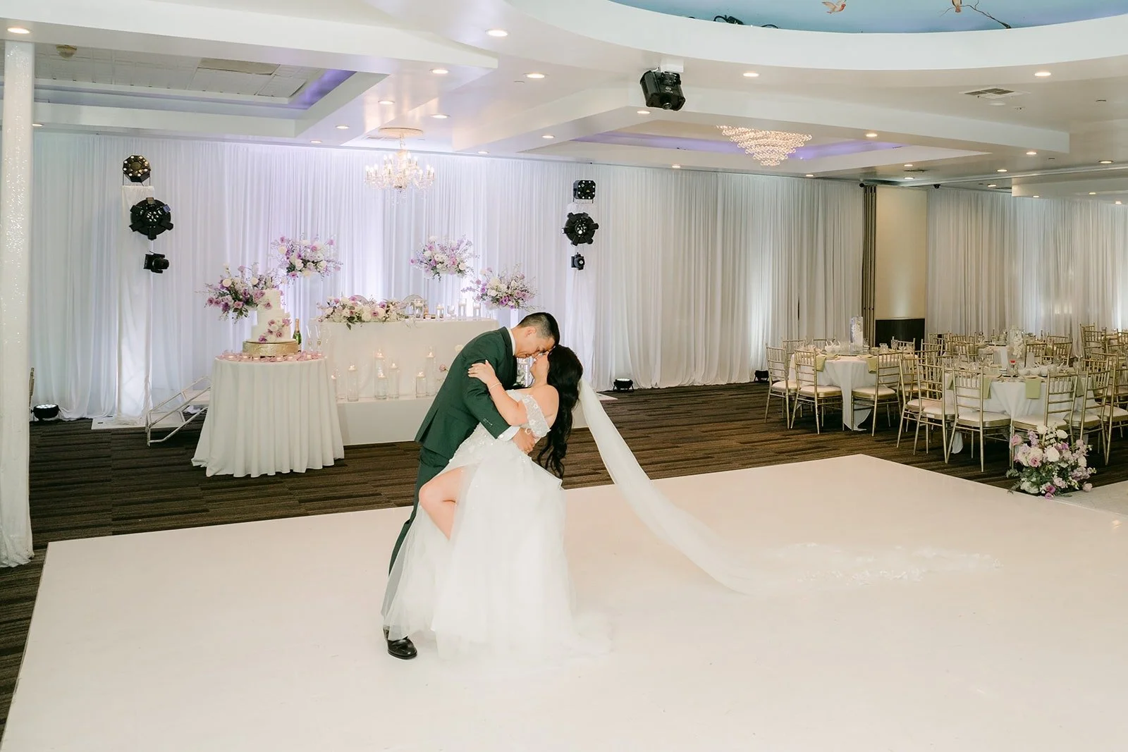 Kevin dips Jennifer on the white dance floor