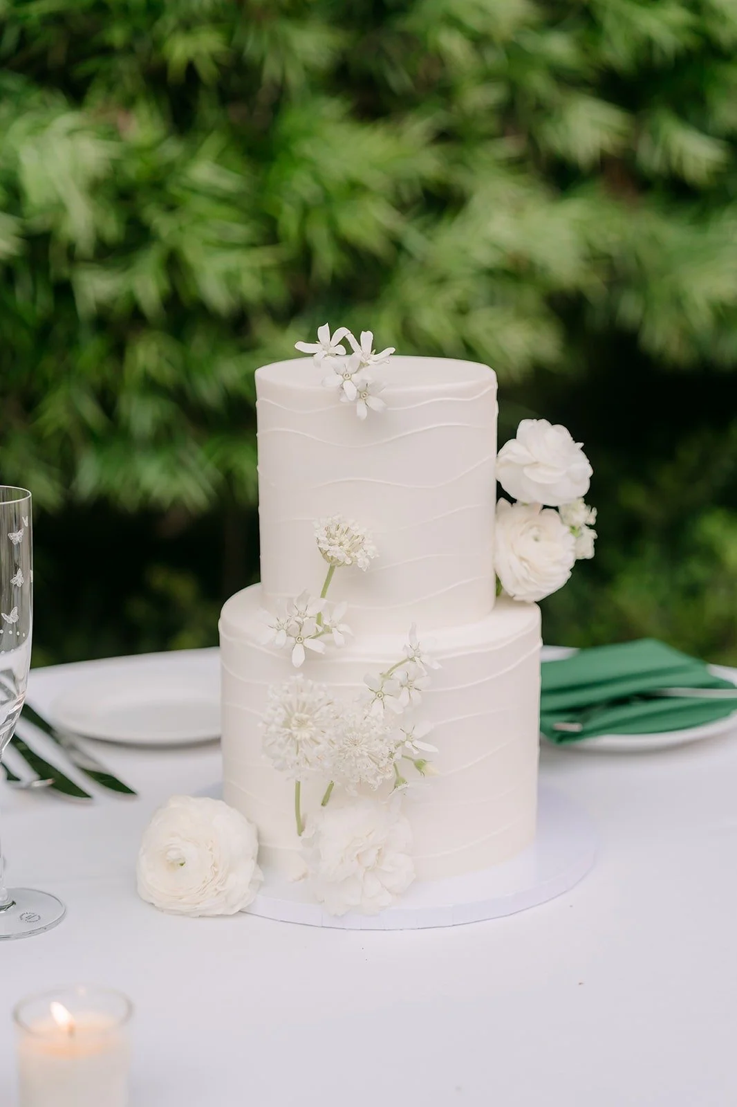 A close look at the tiered white wedding cake