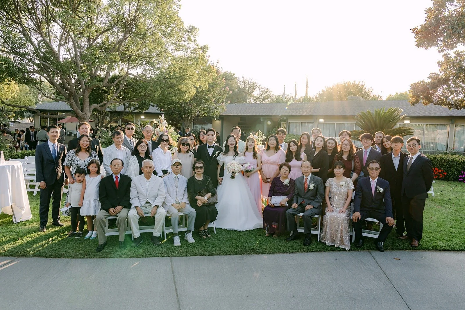 Jeannie and Eunsang with their guests in front of the ceremony site