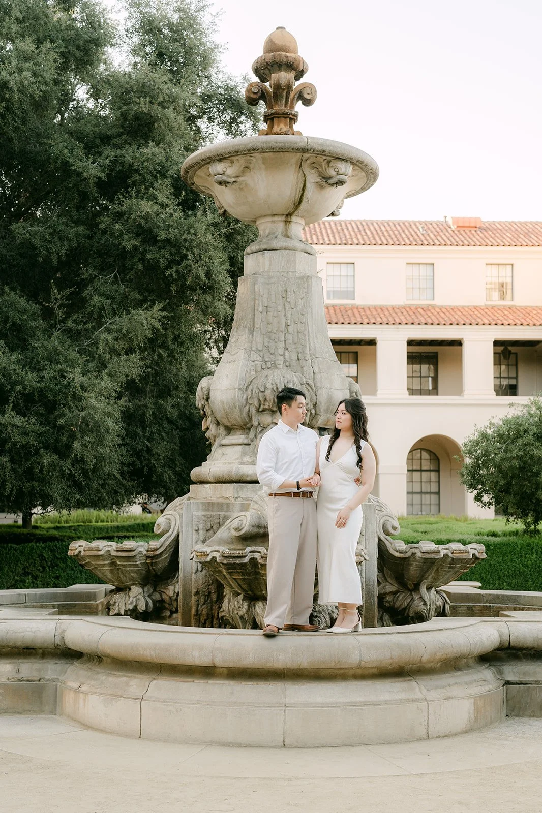 Emily and James stand in front of the ornate central fountain at Pasadena City Hall.