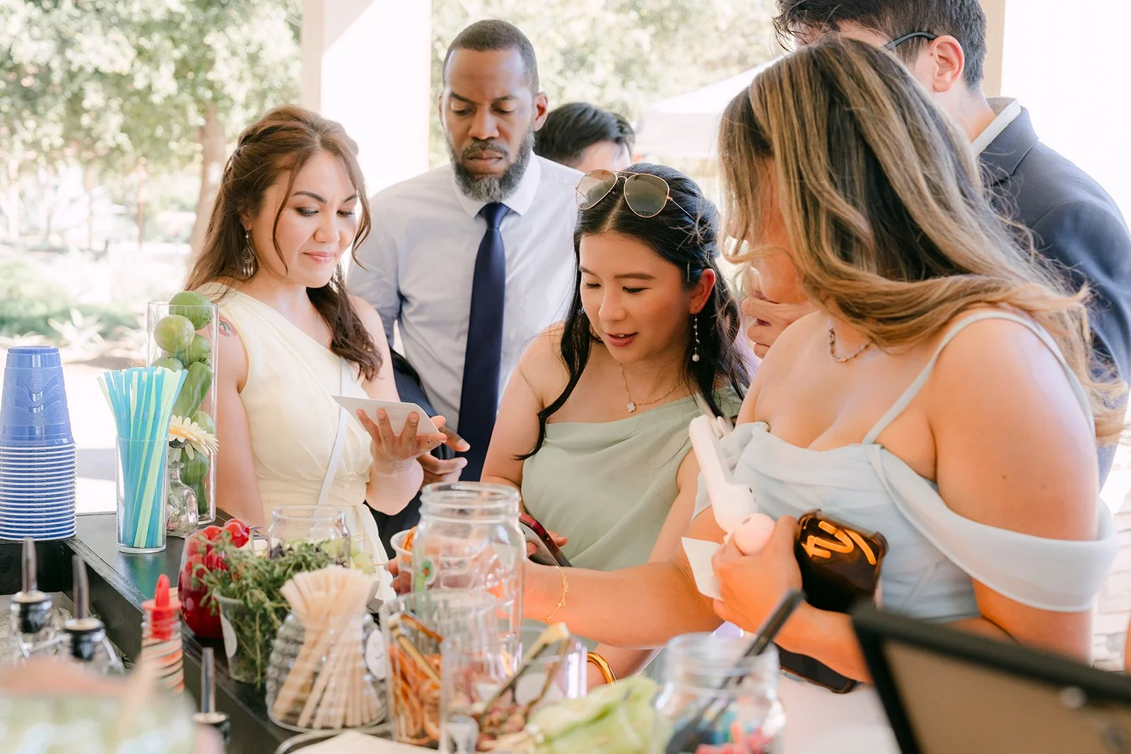 Guests hugging and catching up after the ceremony.