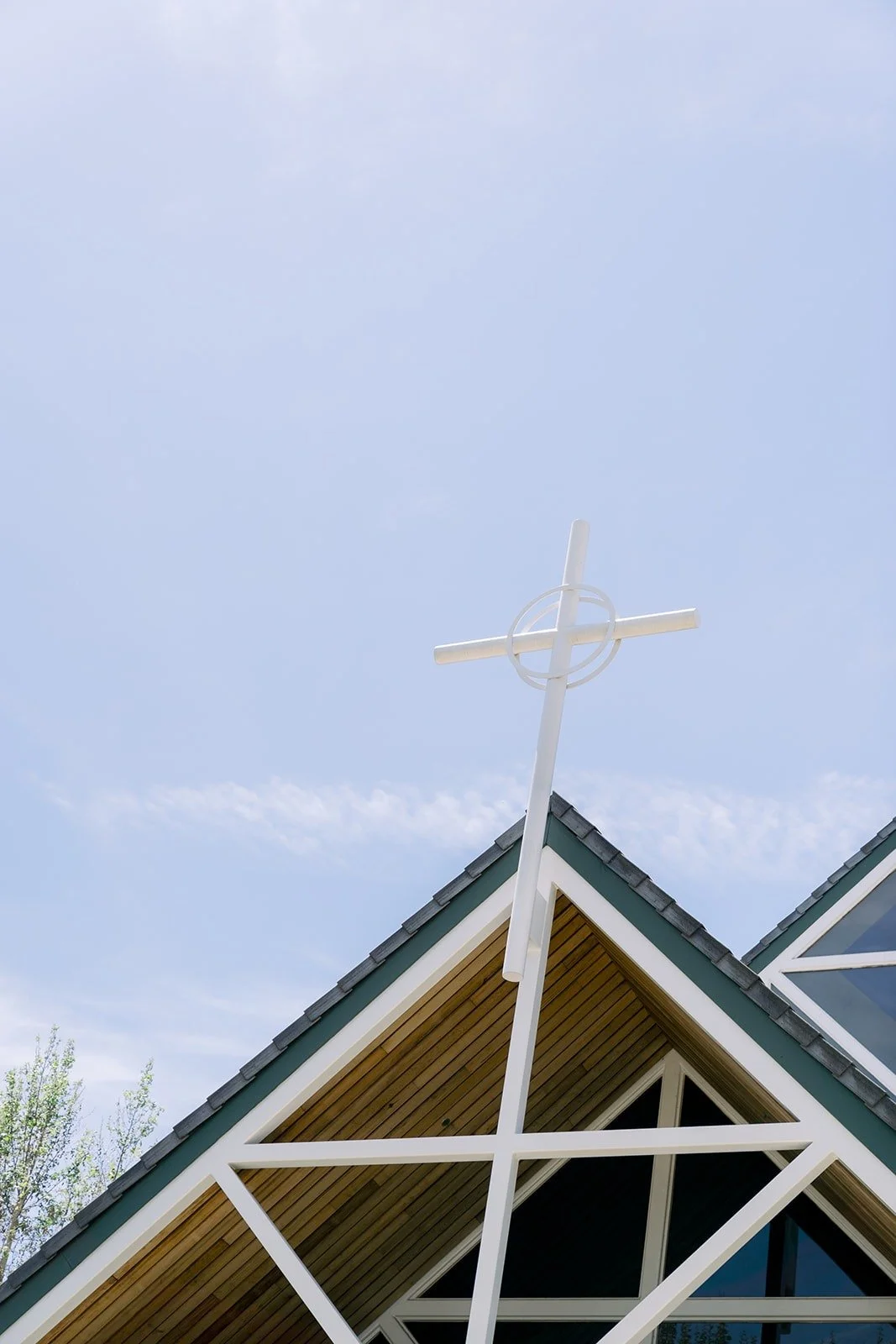 The cross atop St. Paul the Apostle Catholic Church in Chino Hills against a blue sky