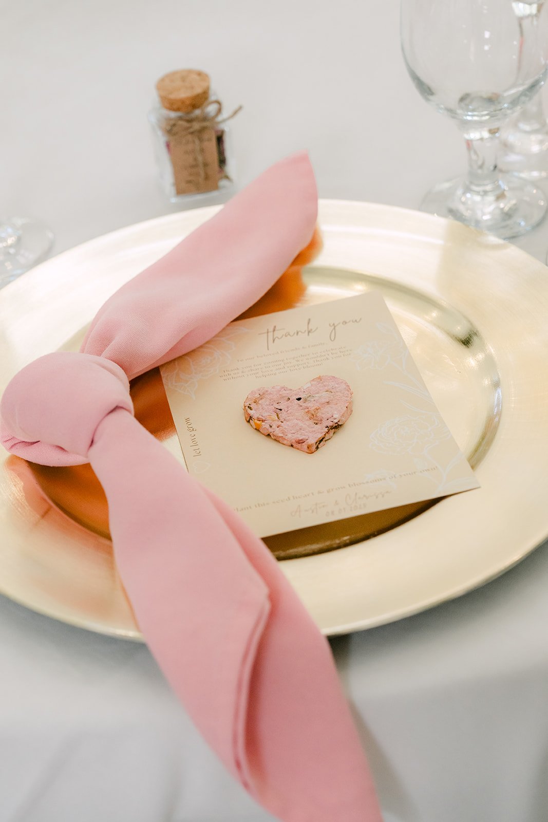 Place setting with a blush napkin bow