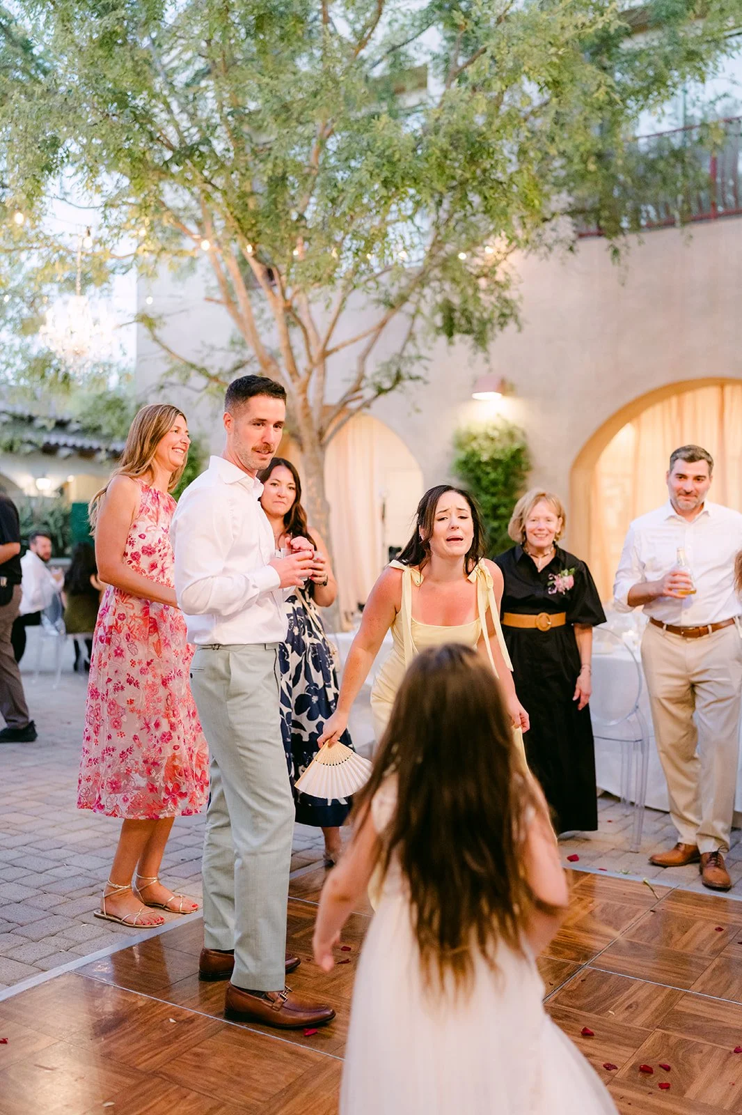 Kids and guests dancing in the courtyard