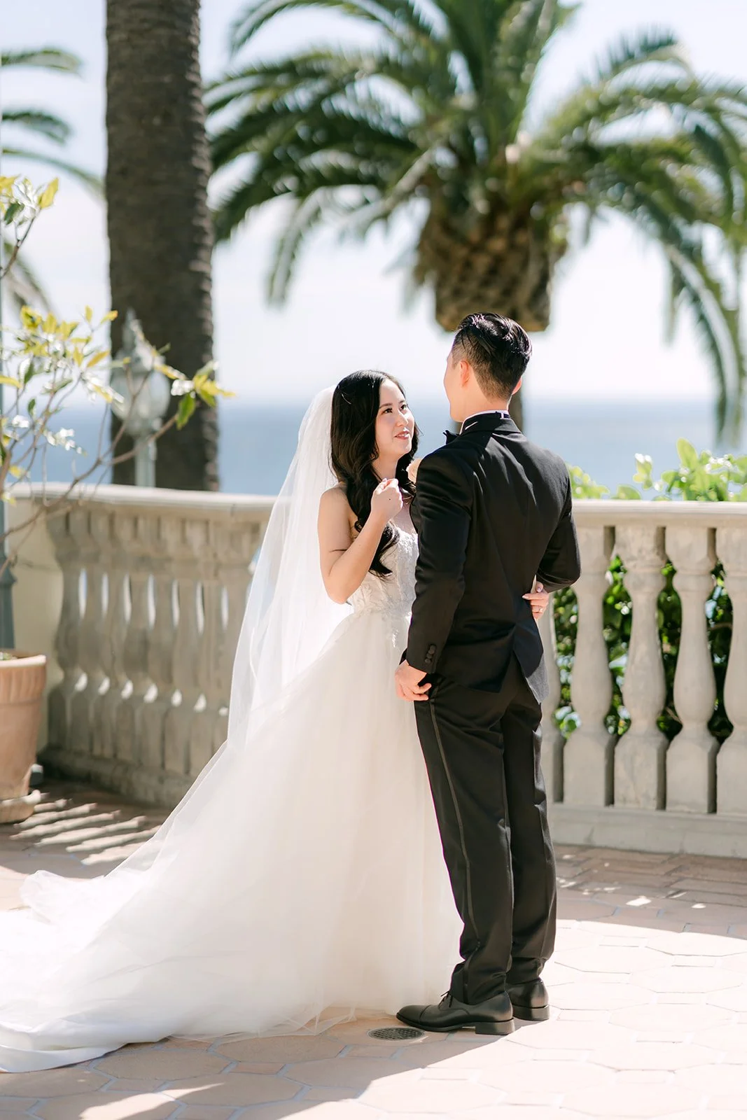 Couple sharing a quiet moment by the terrace balustrade