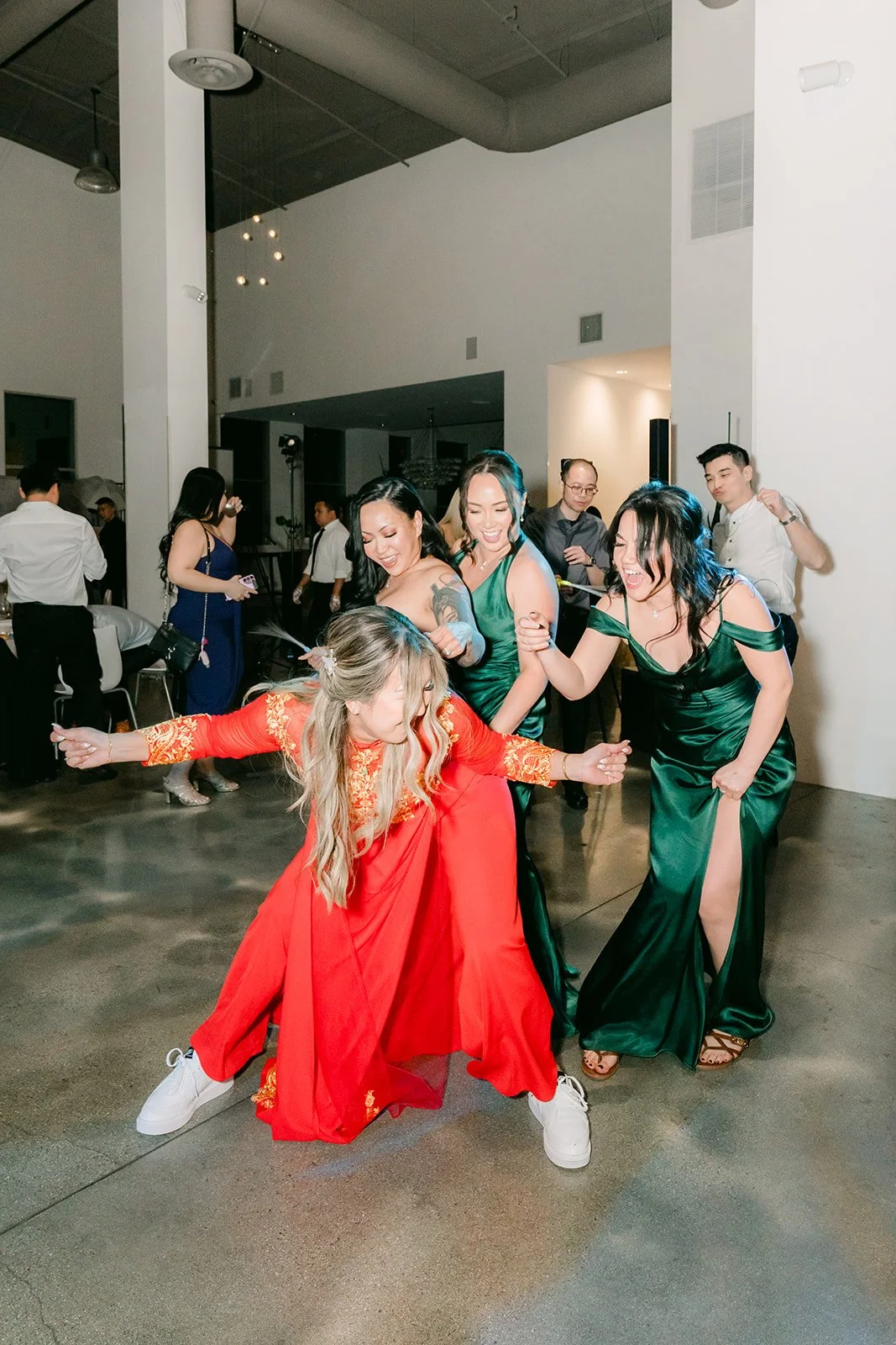 Raine dancing with bridesmaids late in the night