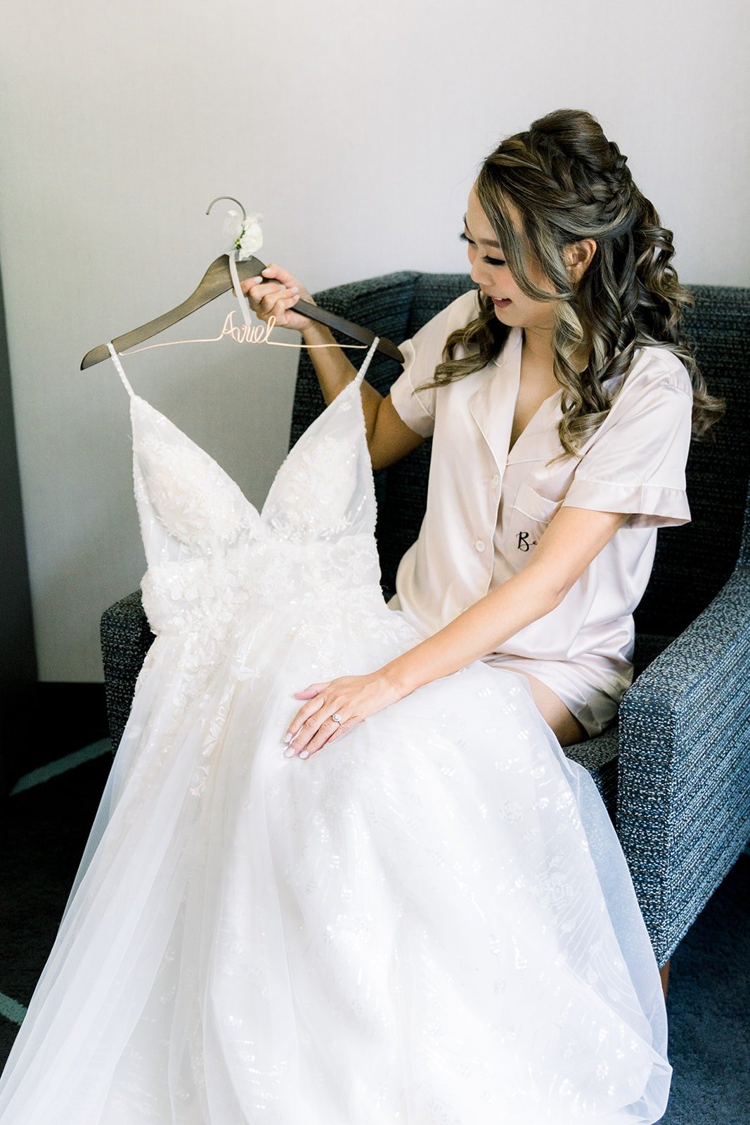 Ariel admiring her gown in the bridal room