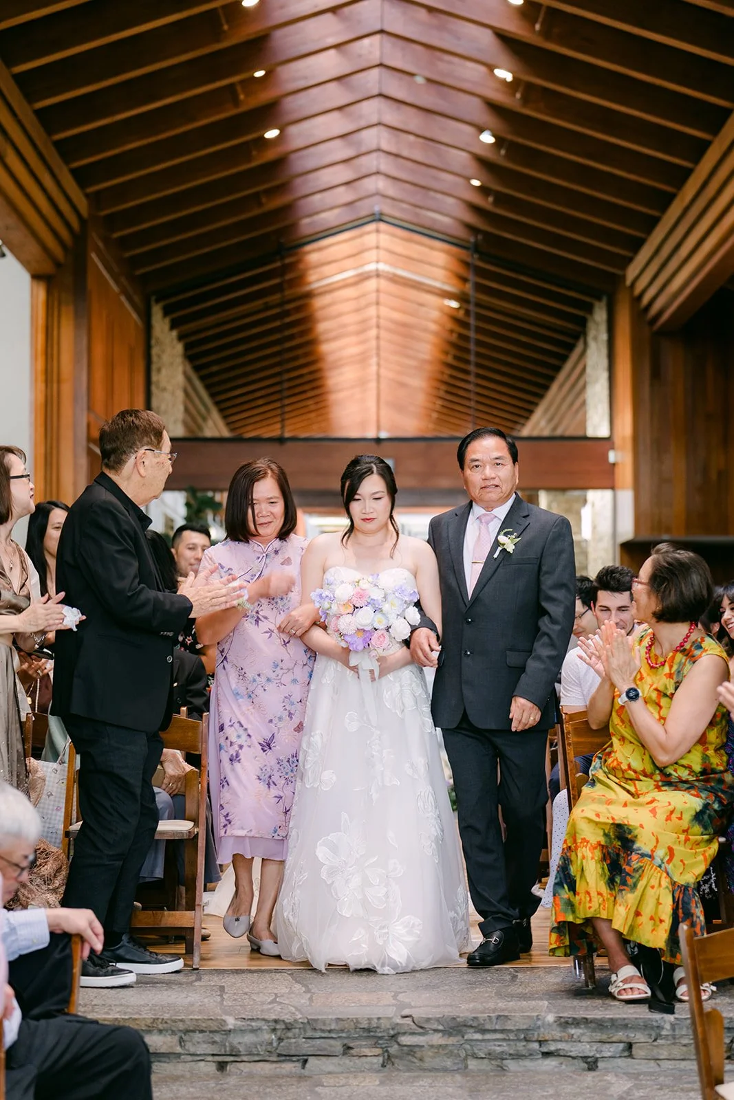 Mary walking down the aisle with her parents
