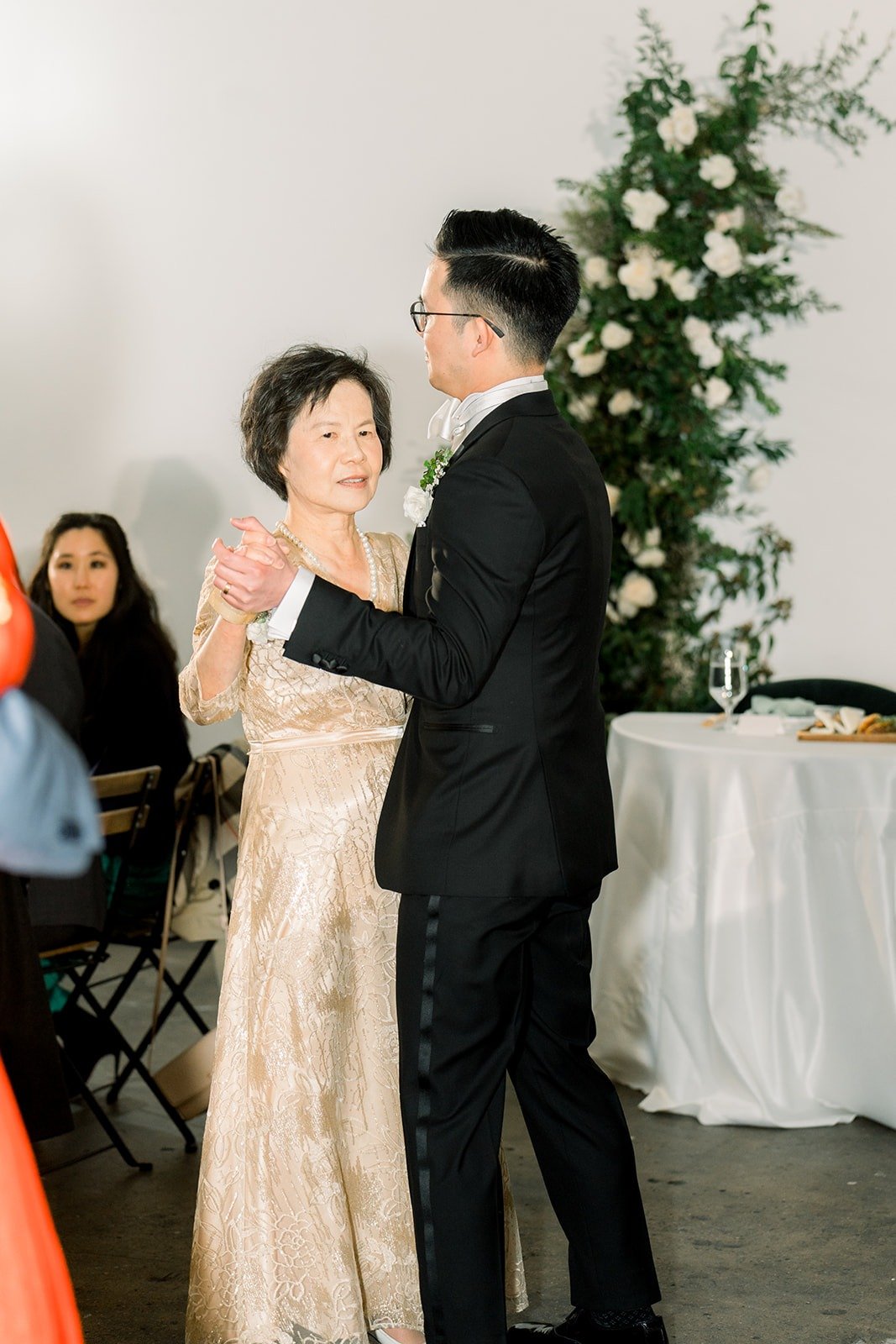 Alex dances with a family member