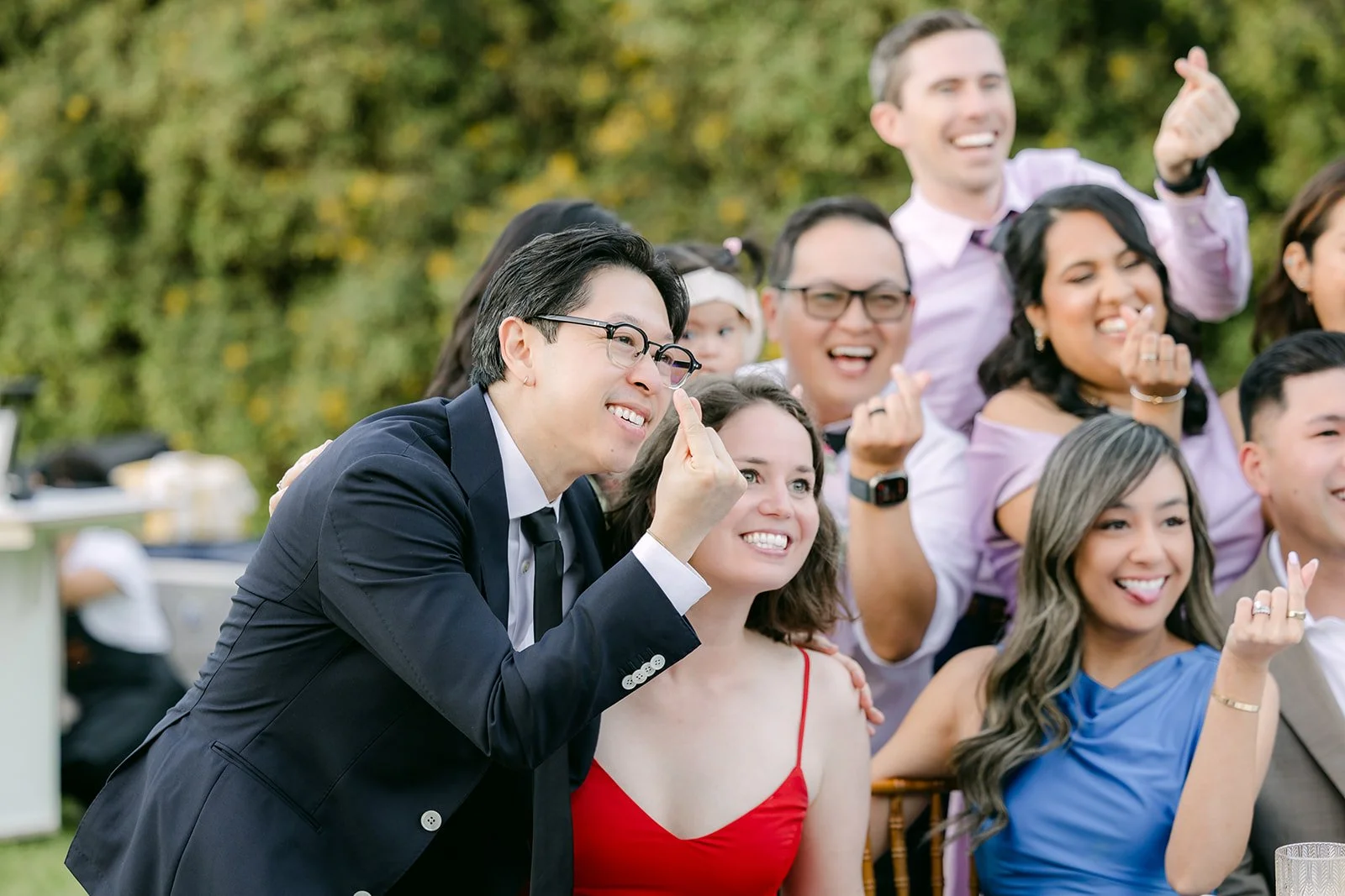 Saya and Leroy celebrating with guests between tables