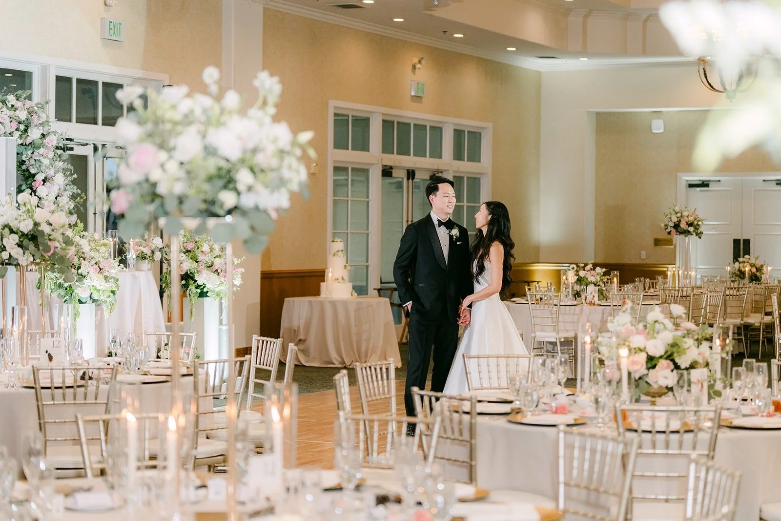 The first dance framed by the floral arch moved to the sweetheart table