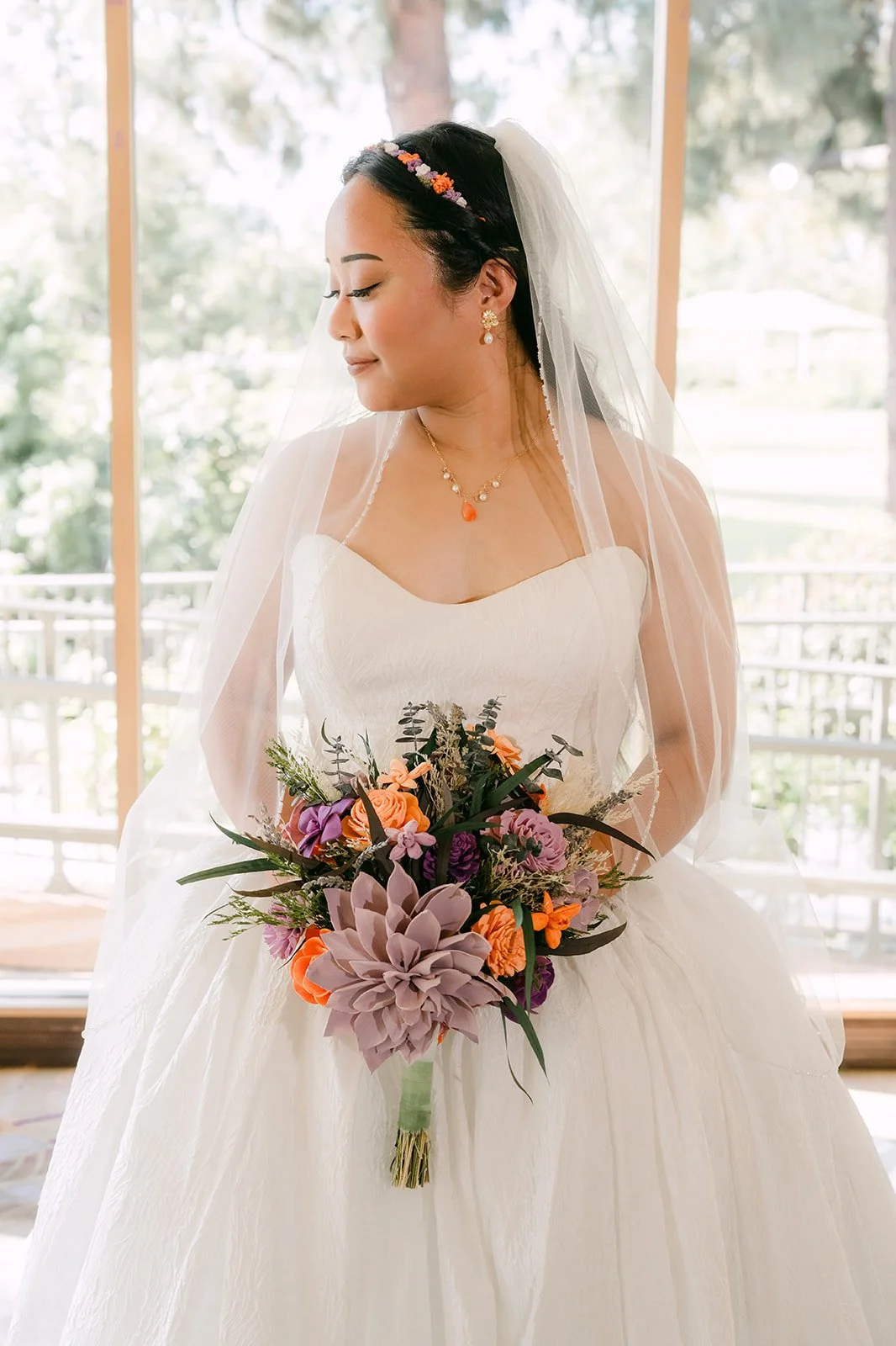 Angela holding her lavender and orange bouquet