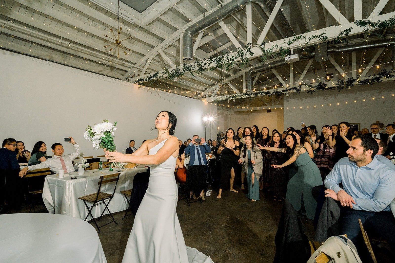 Cindy tosses her bouquet over her shoulder