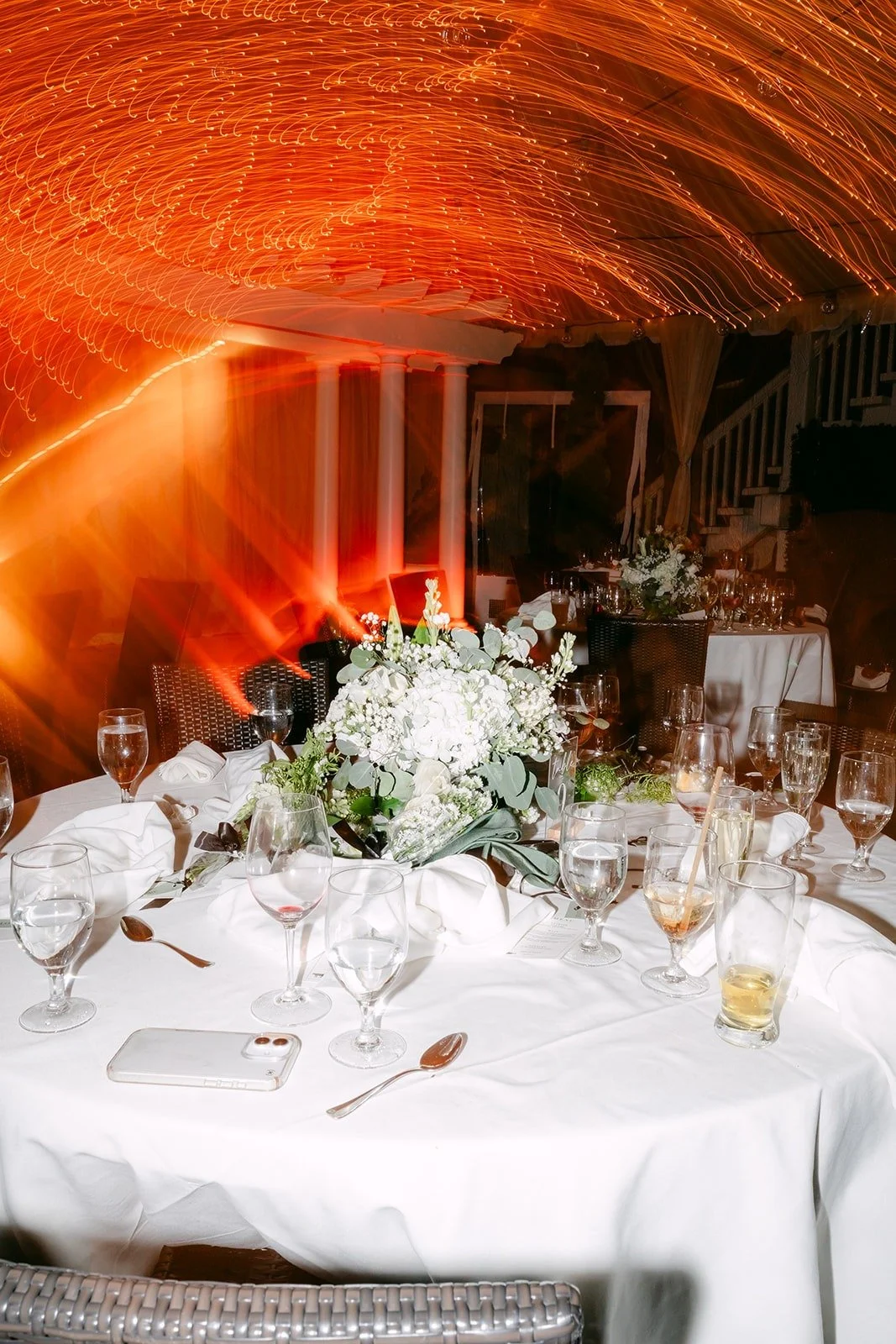 Tables set beneath the warm brick ceiling of a dining room