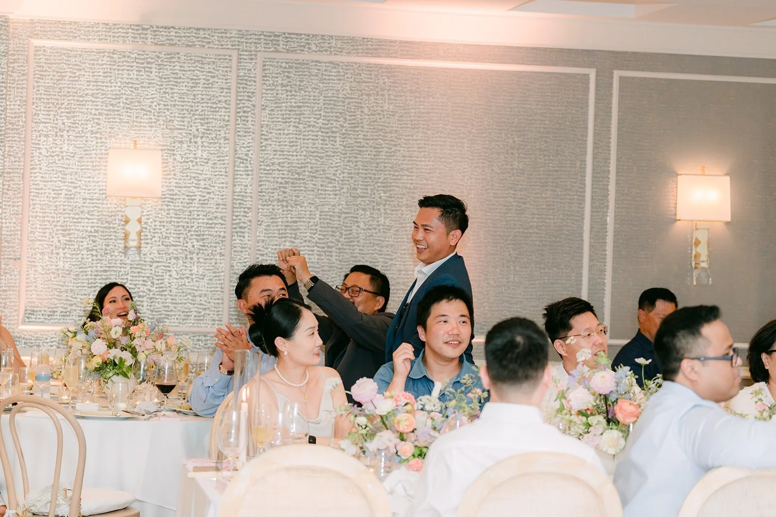 Guests cheering at their tables during the games