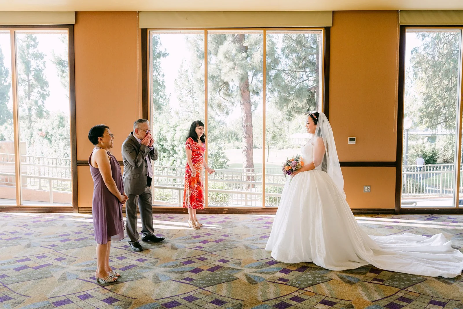 Angela greeting her godparents in the ballroom