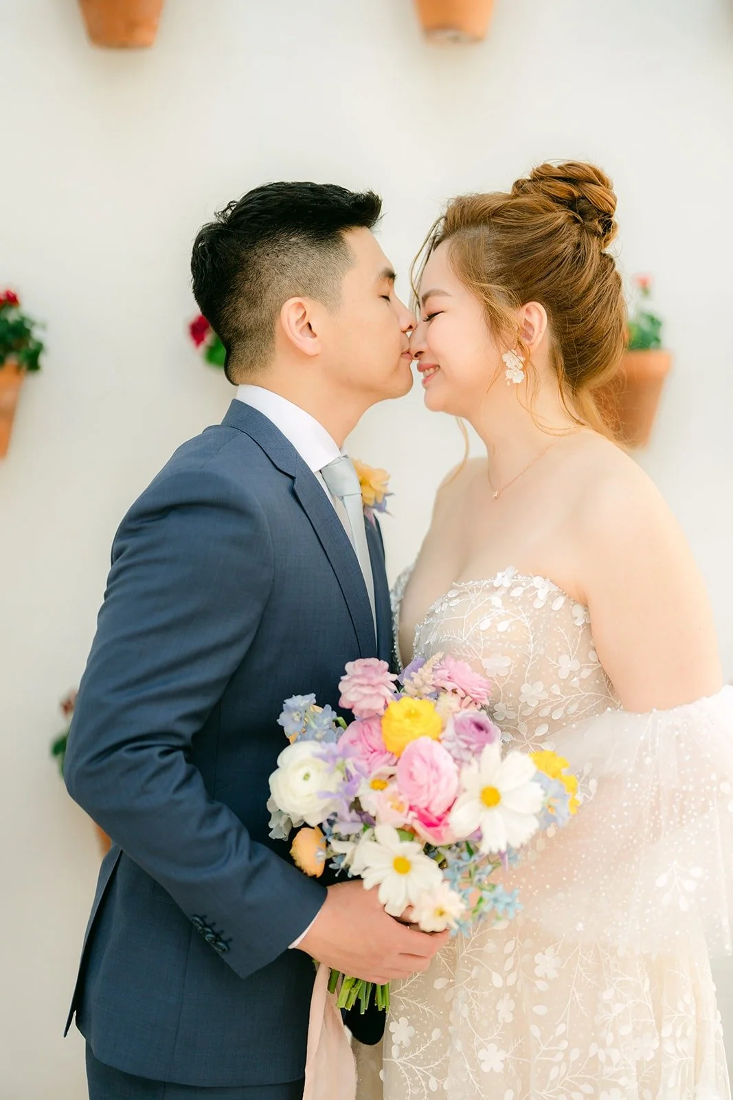 Jerrick kissing Joanna's forehead after their first look, photographed by One and Only Production