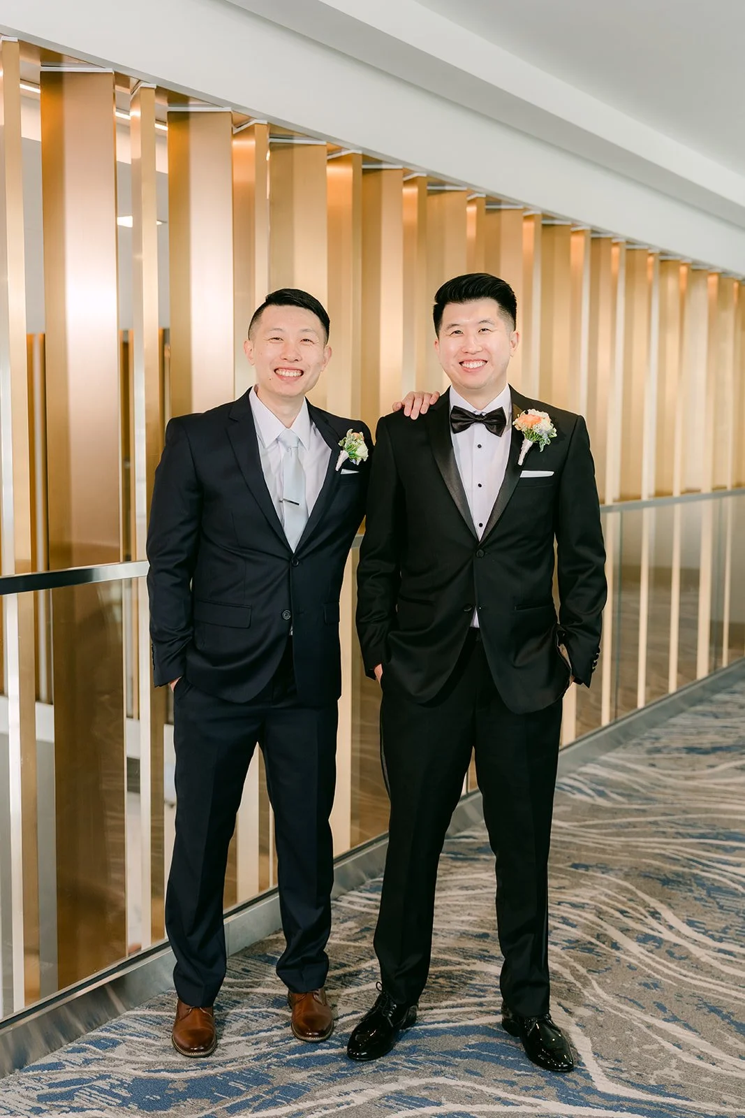 San and a groomsman standing together.