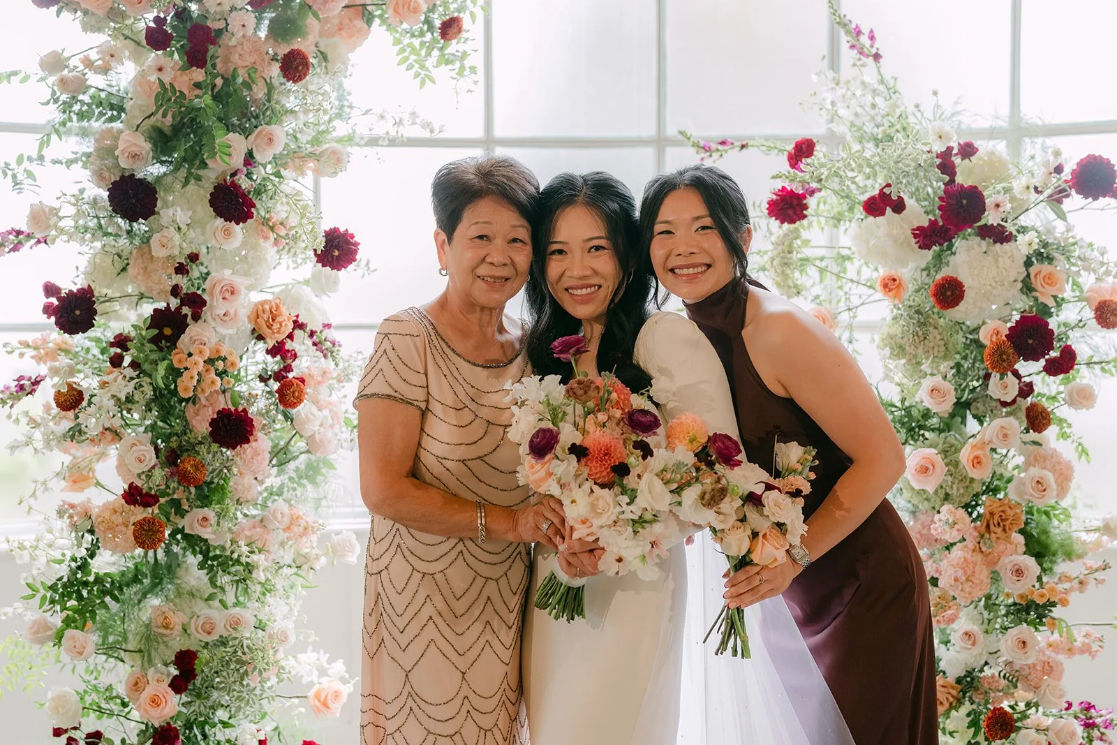Denise laughing with her mom and sister.