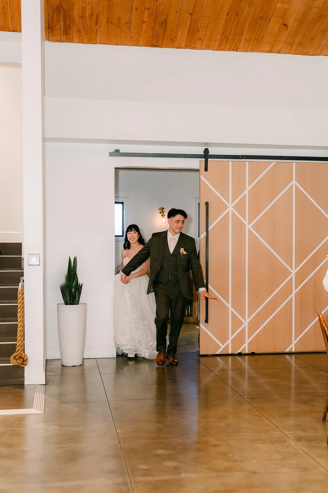 Vivian and Alex entering through the barn doors