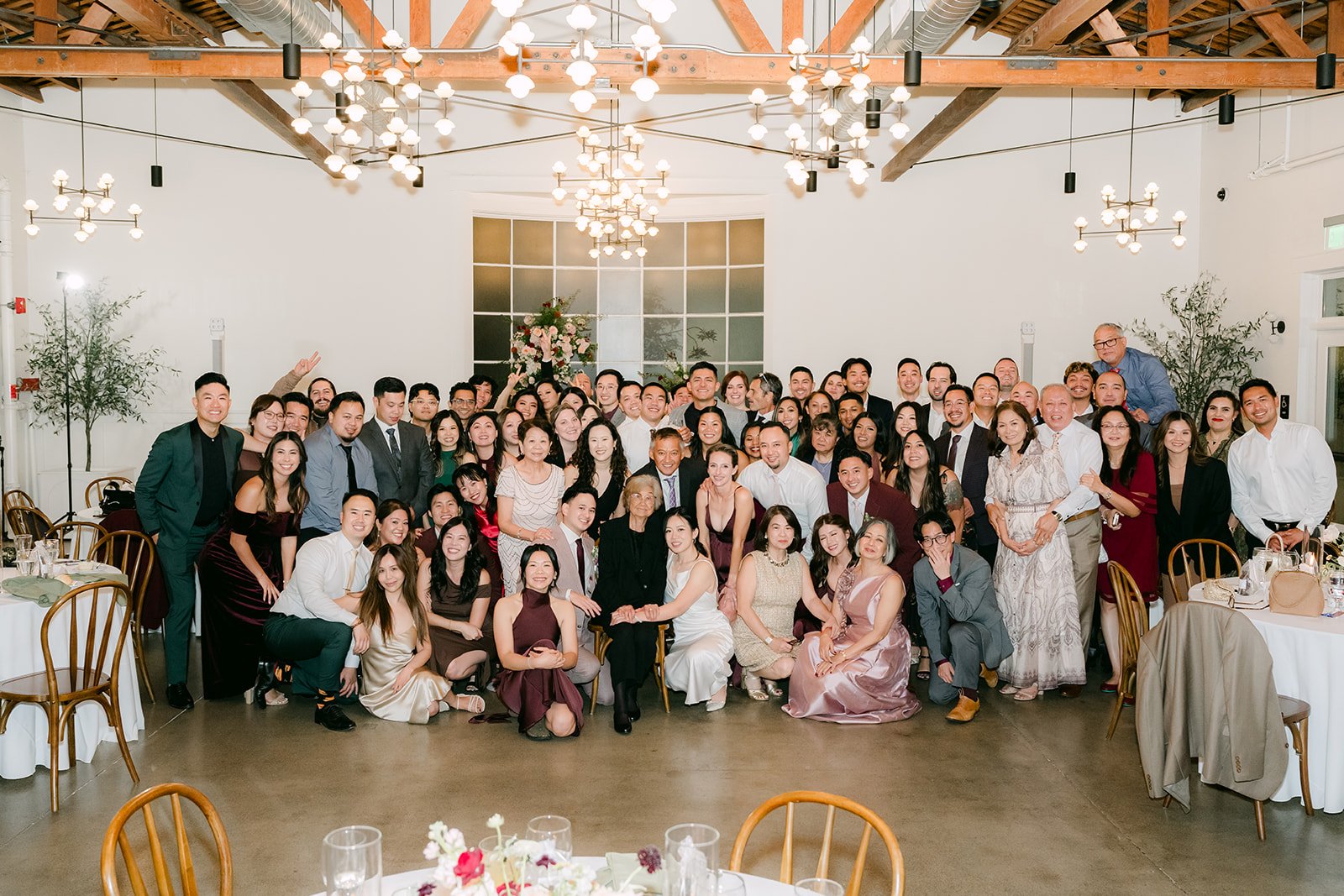 Group photo of all of Denise and Michael's guests in the ballroom.
