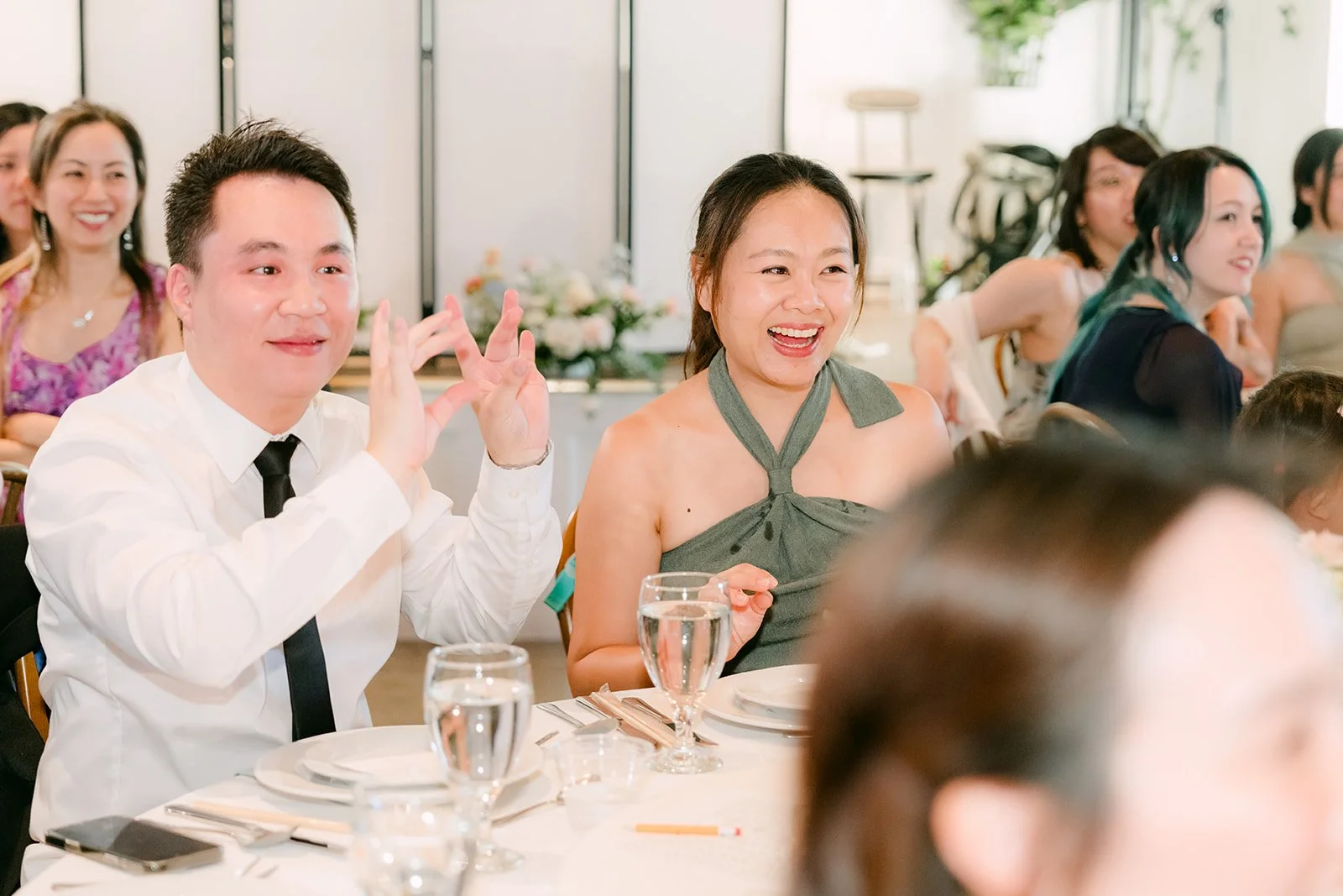 Guests laughing during the speeches