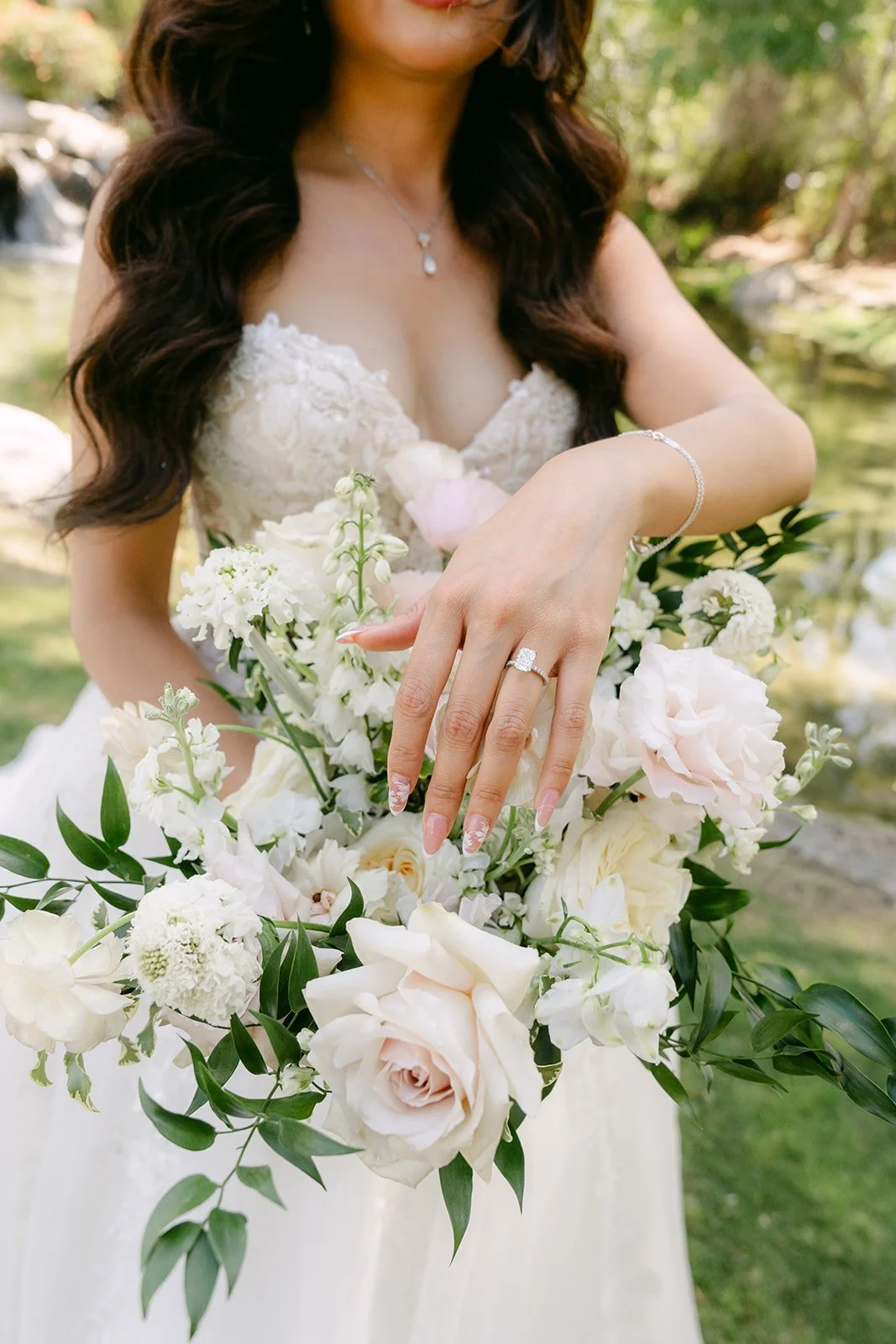 Sandra holding her cream and blush bouquet at Coyote Hills.