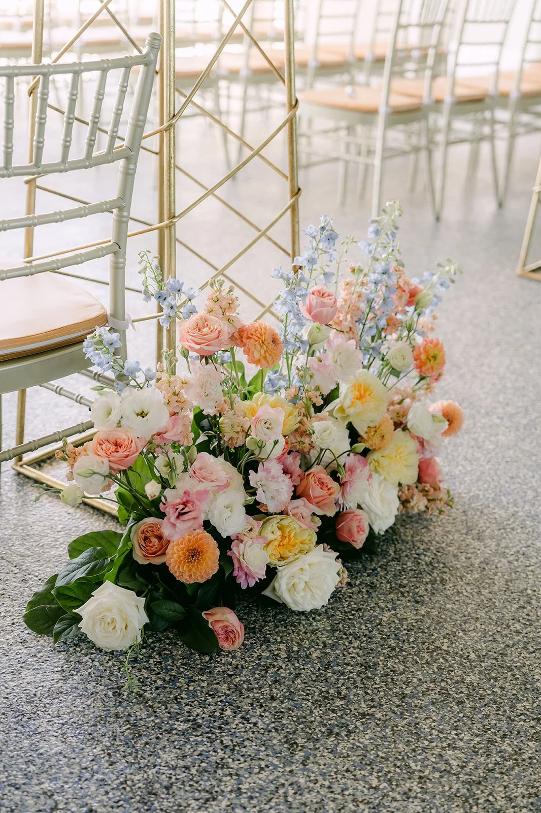 Pastel aisle florals at the ceremony on the terrace.