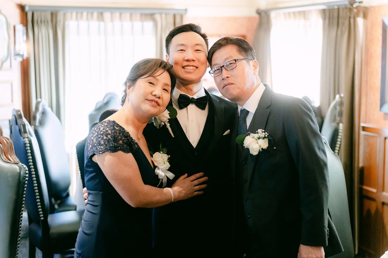 Jason sharing a laugh with family members before the ceremony