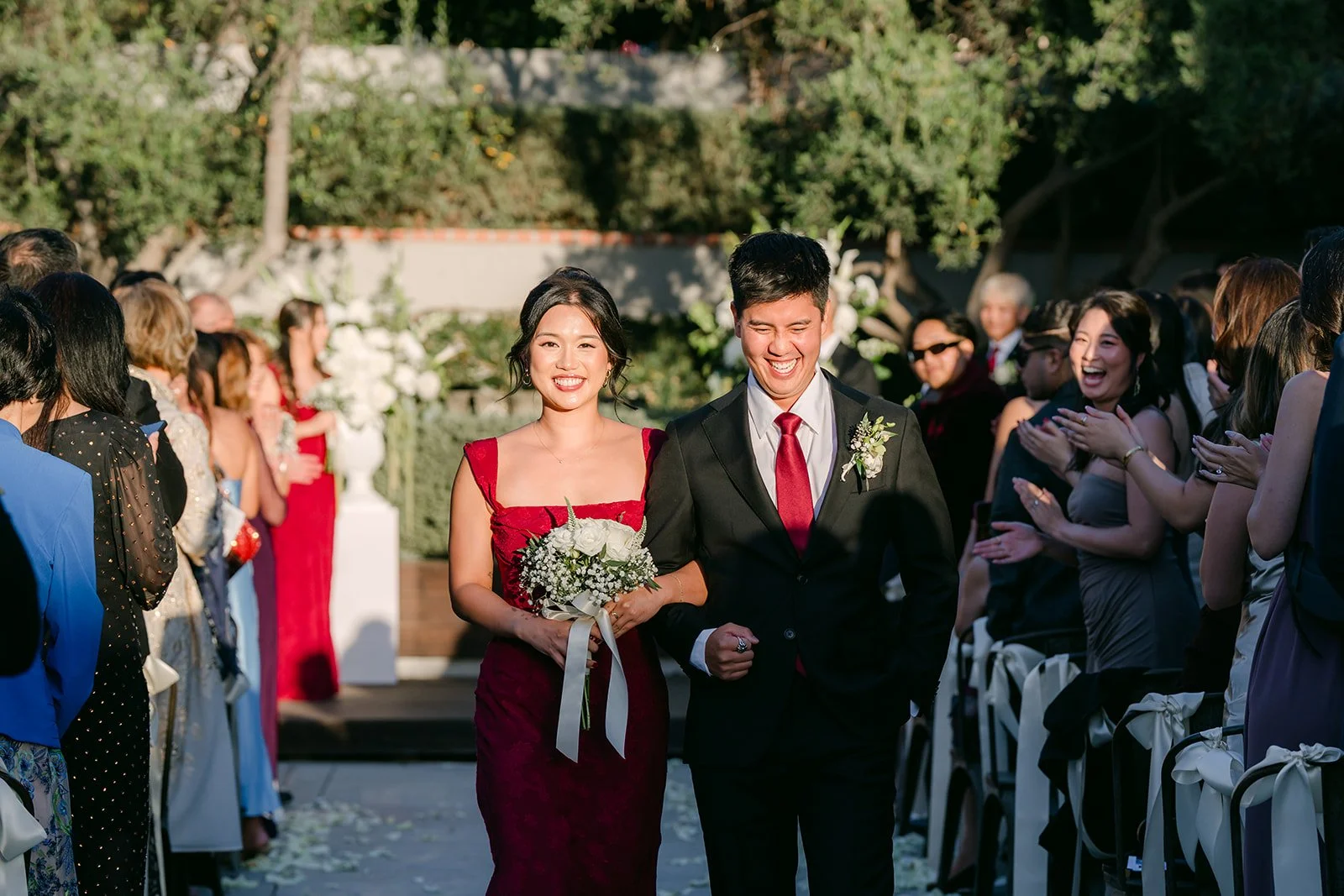 Wedding party walking back up the aisle, photographed by One and Only Production