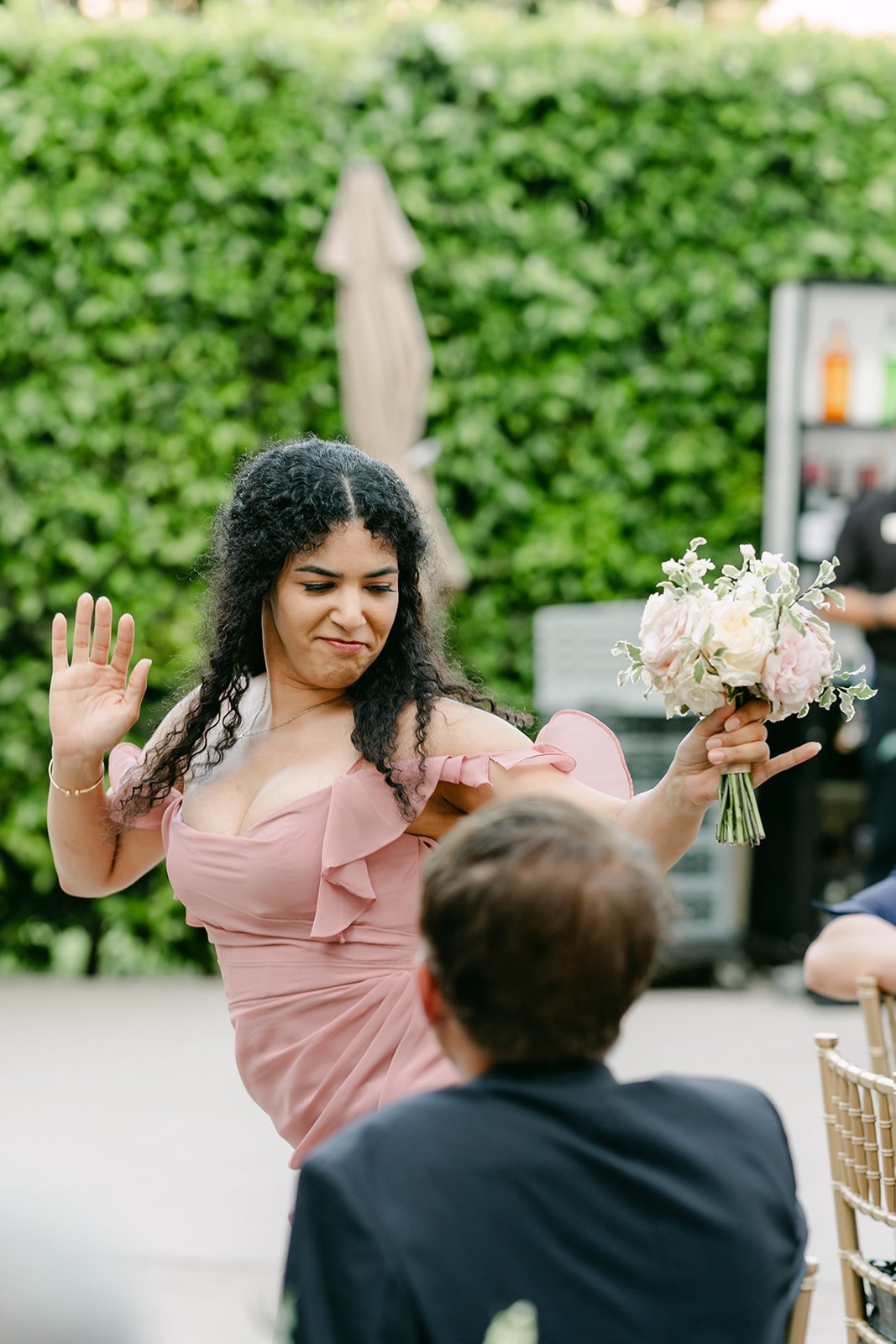 A bridesmaid dancing into the reception.