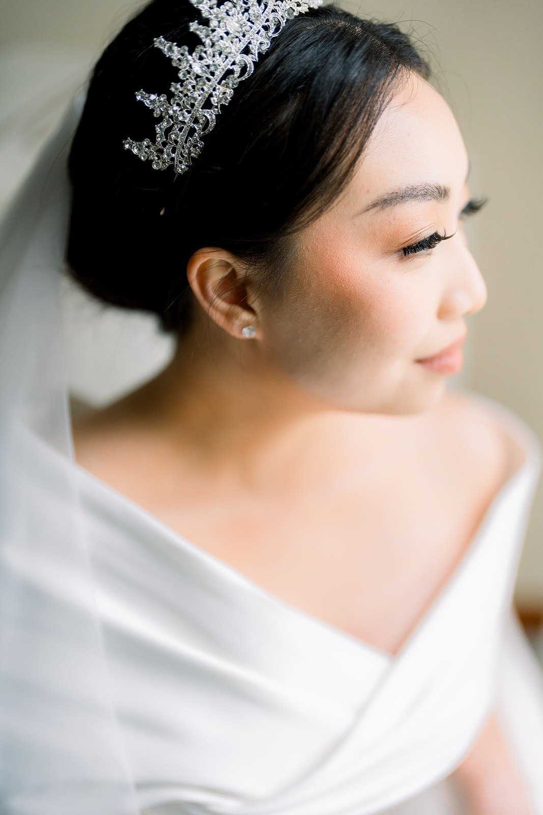 Close portrait of Jacinda in her tiara and veil
