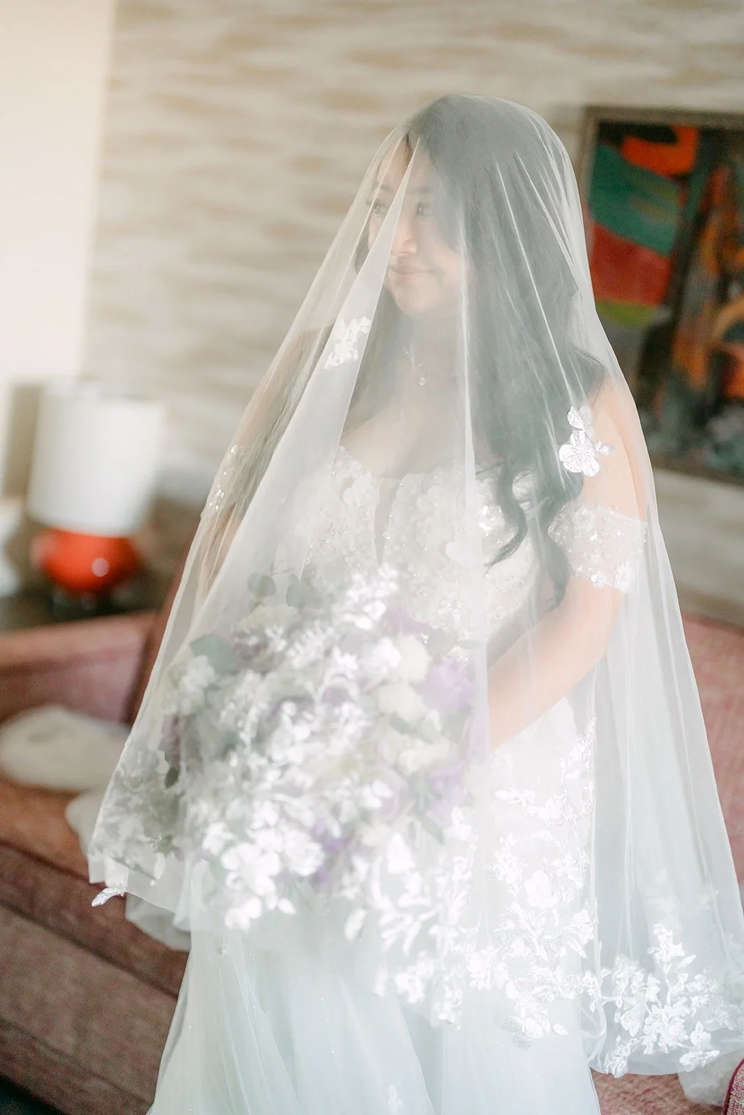Jennifer under her lace edged cathedral veil