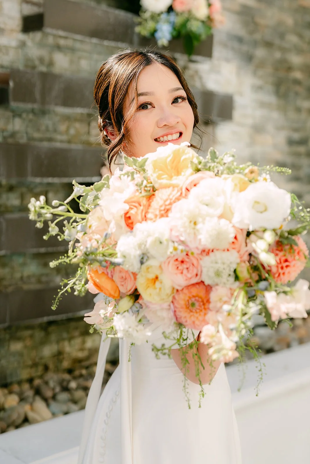 Amanda smiling over her spring bouquet.