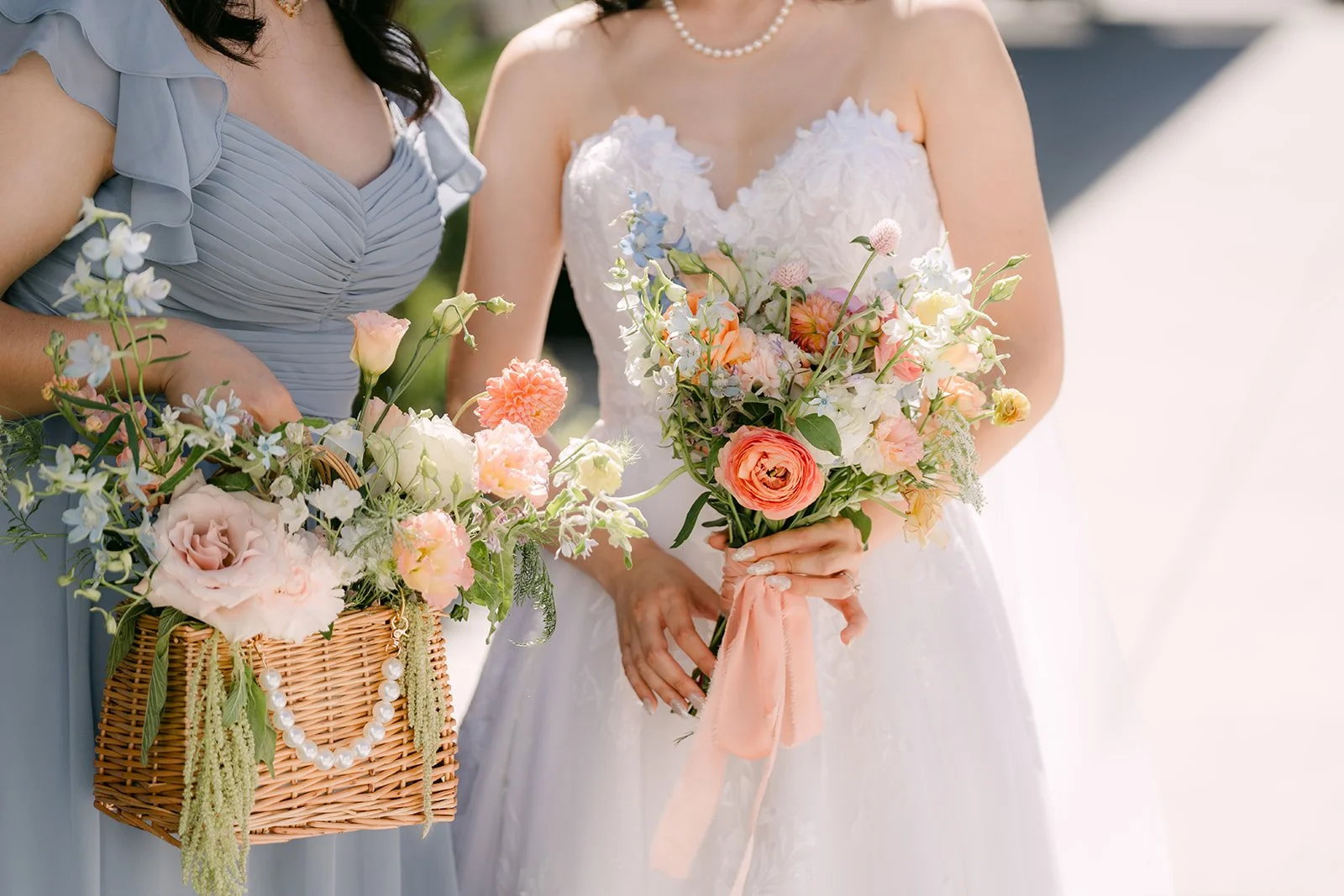 Close up of flower baskets and the bride's bouquet