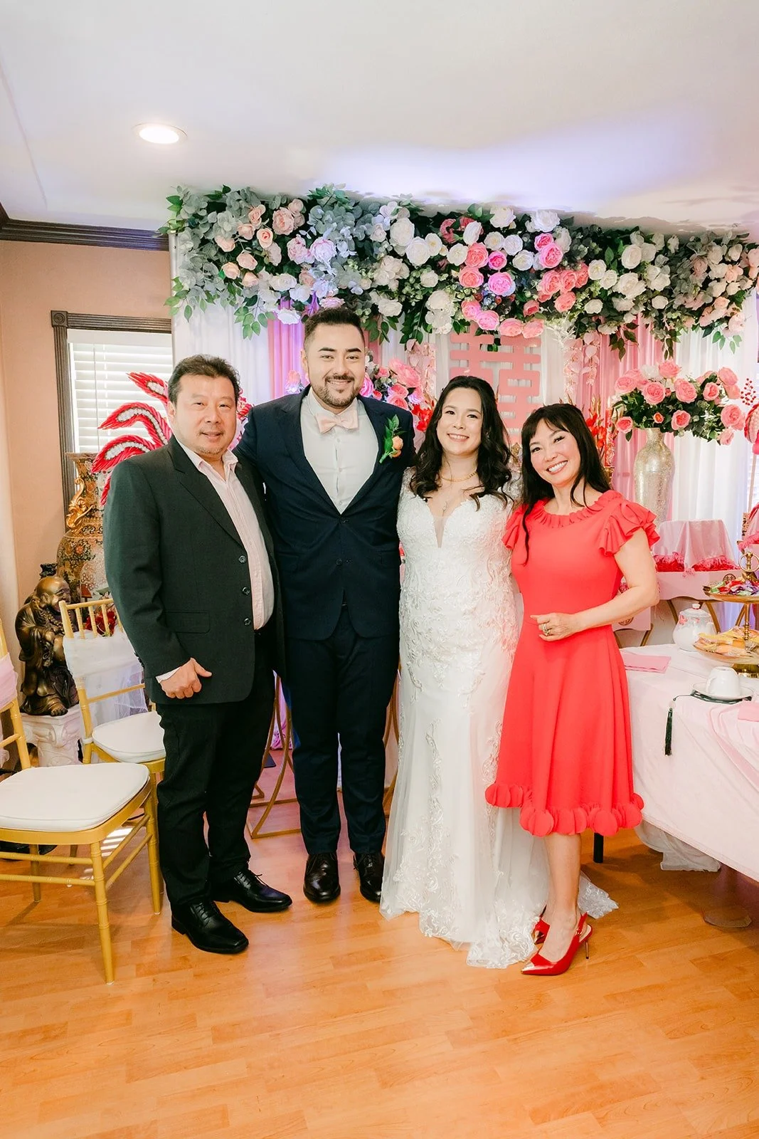 Amy and James posing with relatives after the tea ceremony