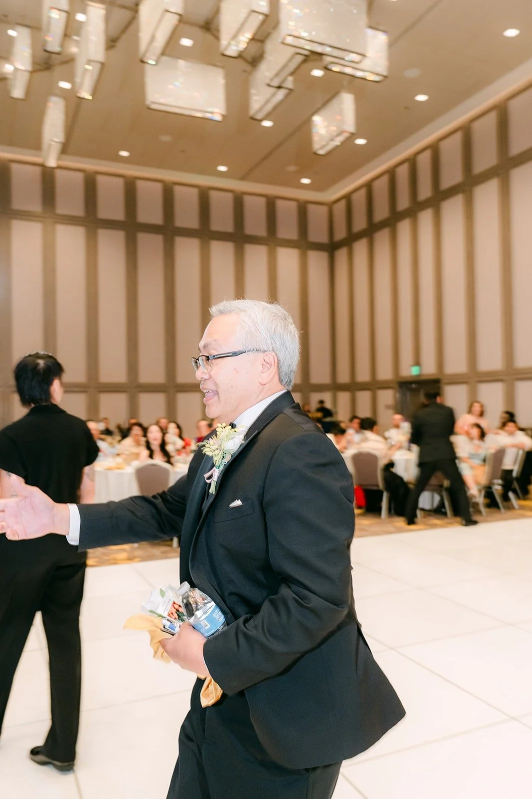 A guest racing across the dance floor during a reception game